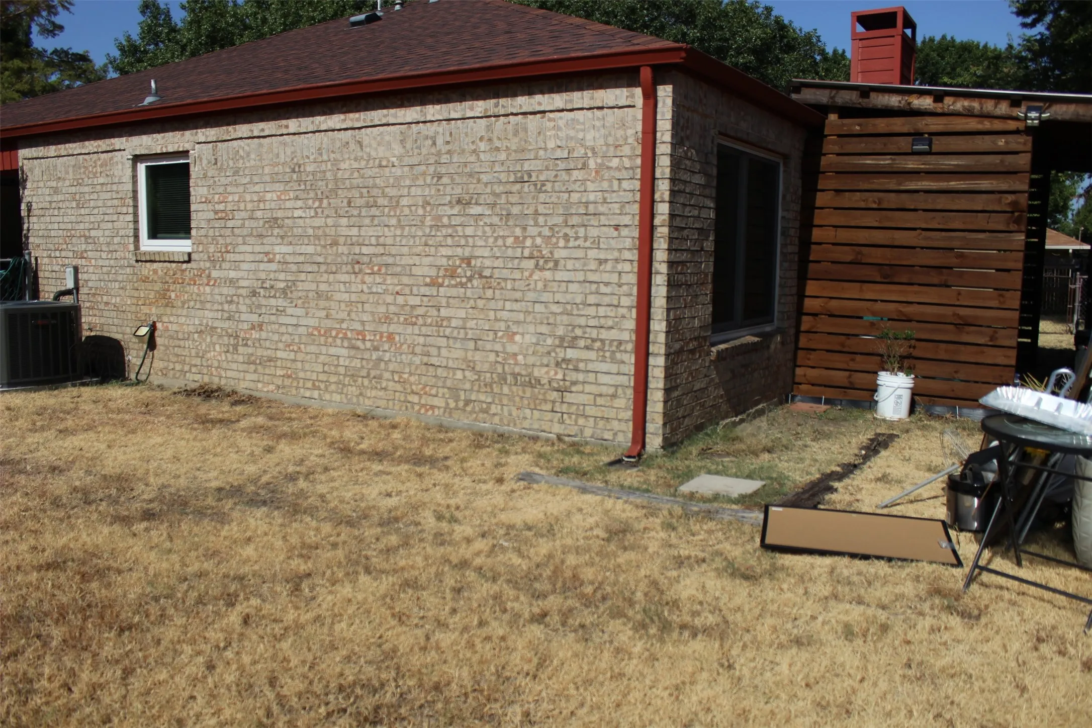 Brick exterior with red trim