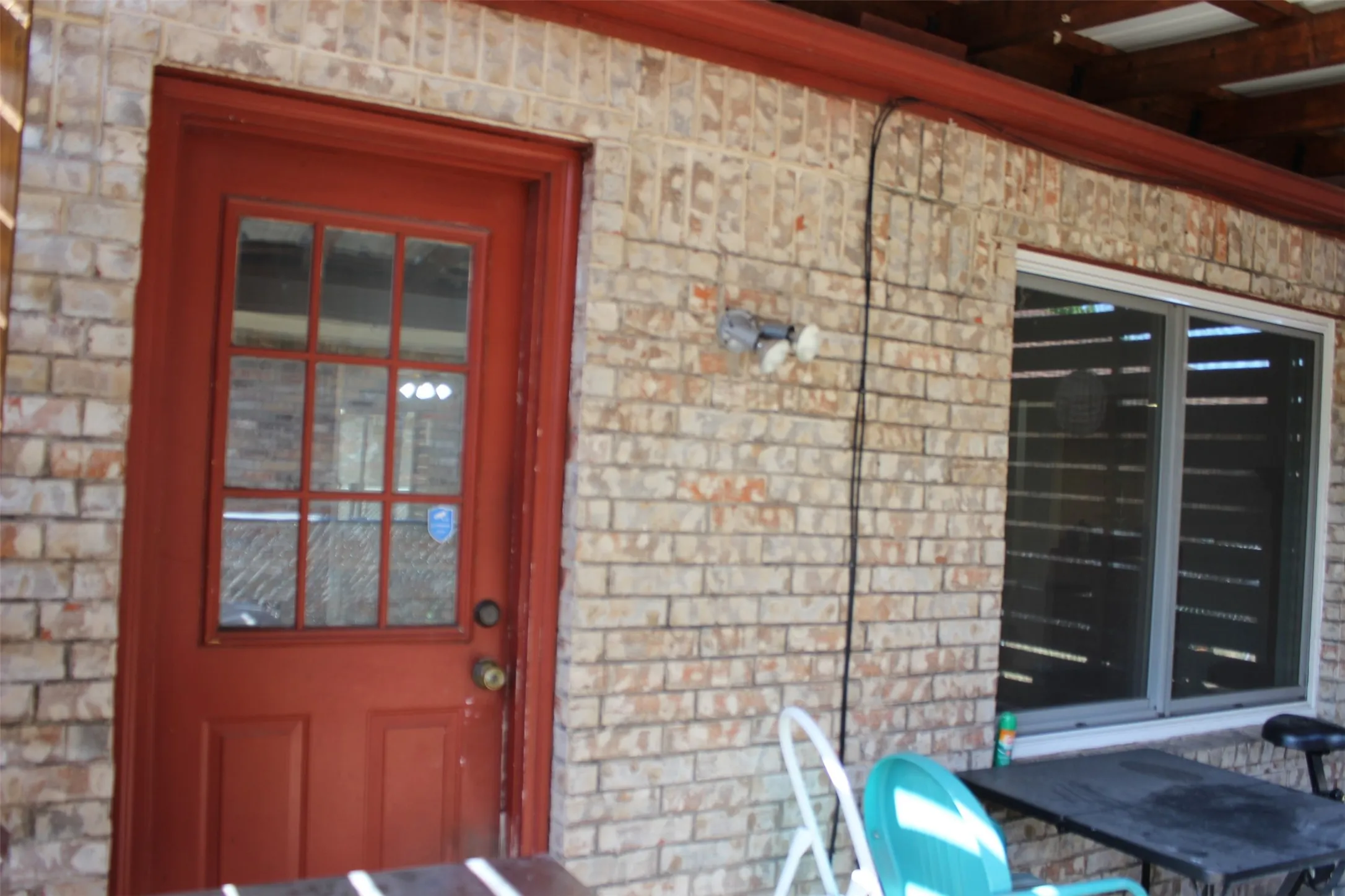 Brick exterior with red trim