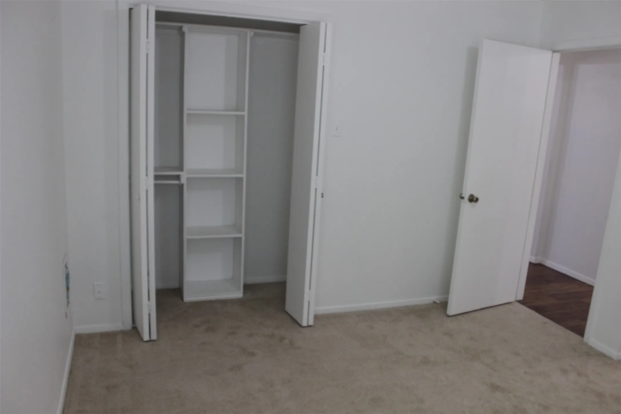 Built-in closet shelving provides organized storage