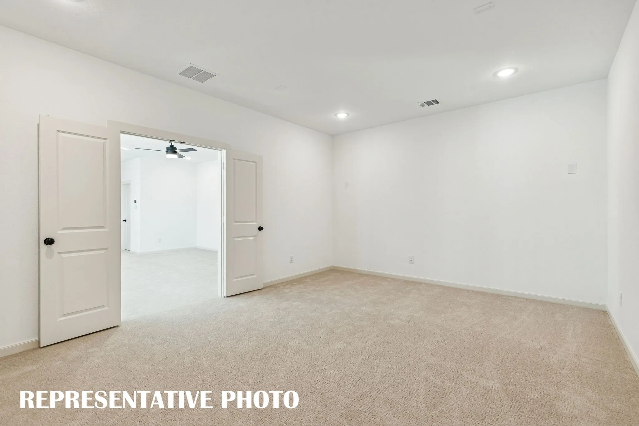 The spacious media room paired with adjacent game room created the ultimate family entertainment zone!REPRESENTATIVE PHOTO