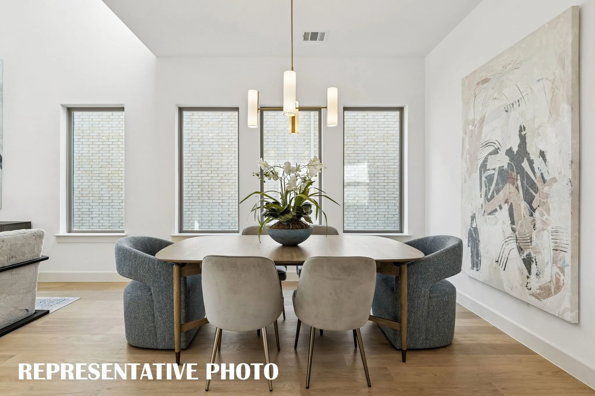 Whether it's lively dinner parties or cozy family get togethers, this light filled dining room fits all occasions!  REPRESENTATIVE PHOTO