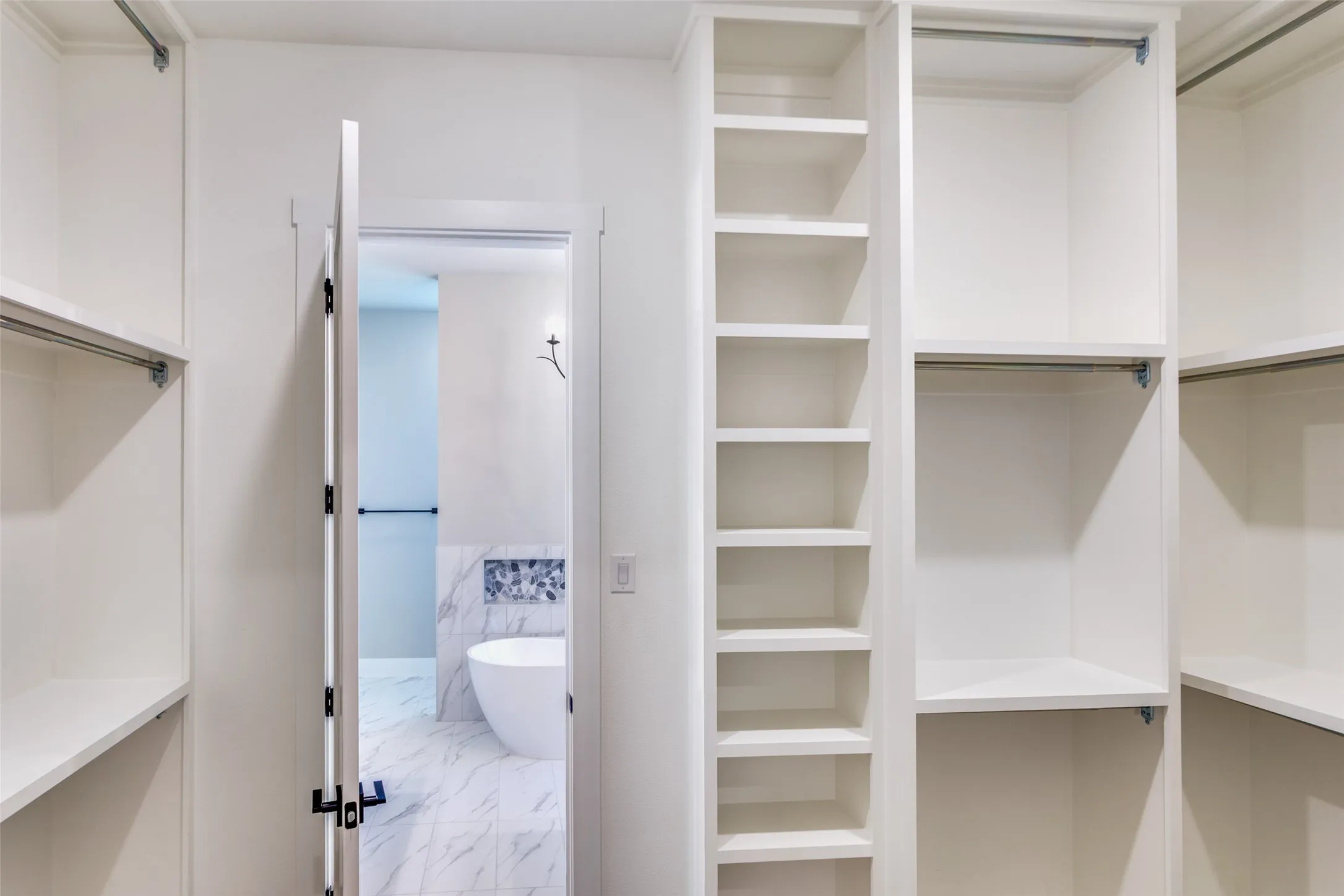 Built-in closet system with shelving and hanging rods
