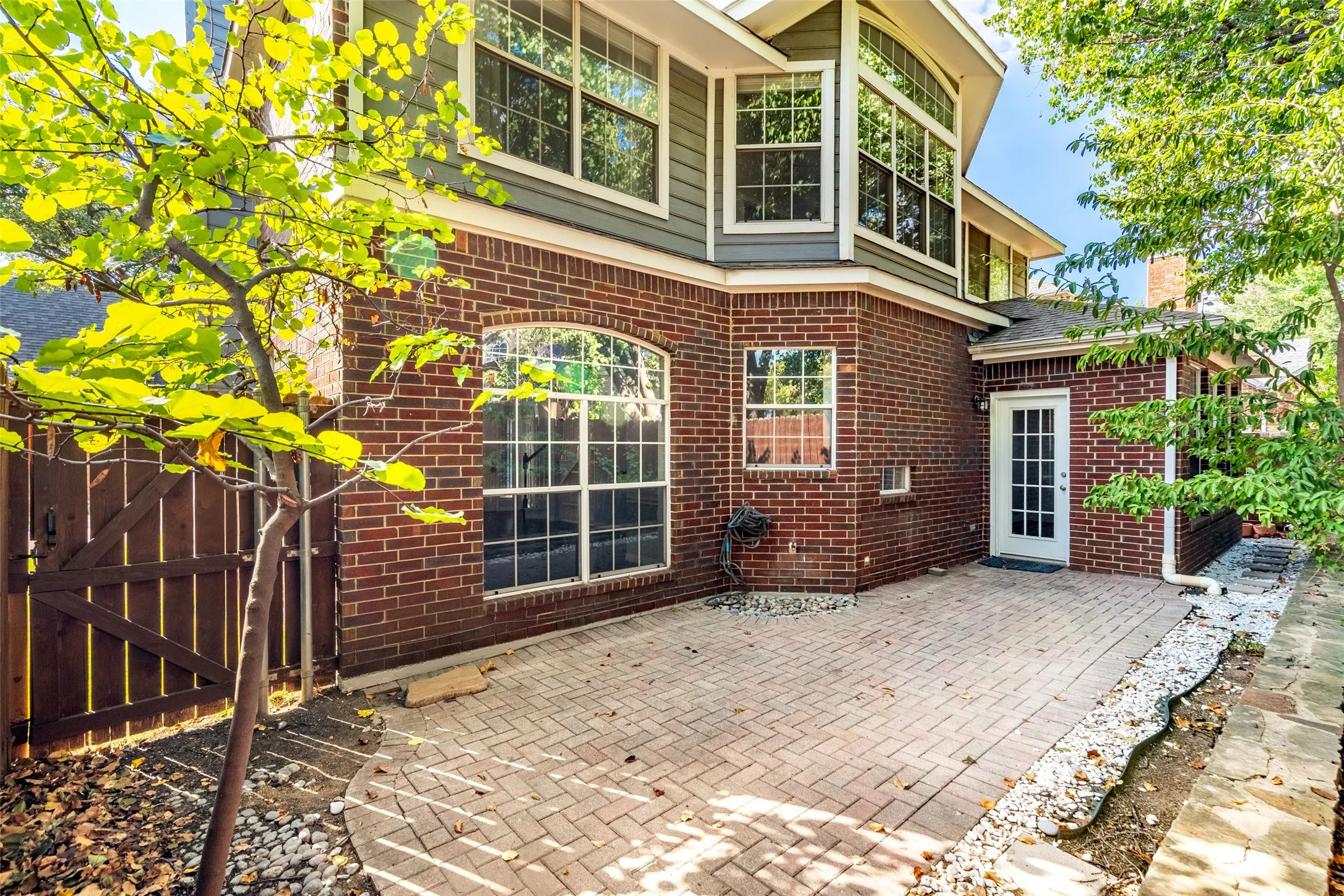 Brick exterior with second-story siding