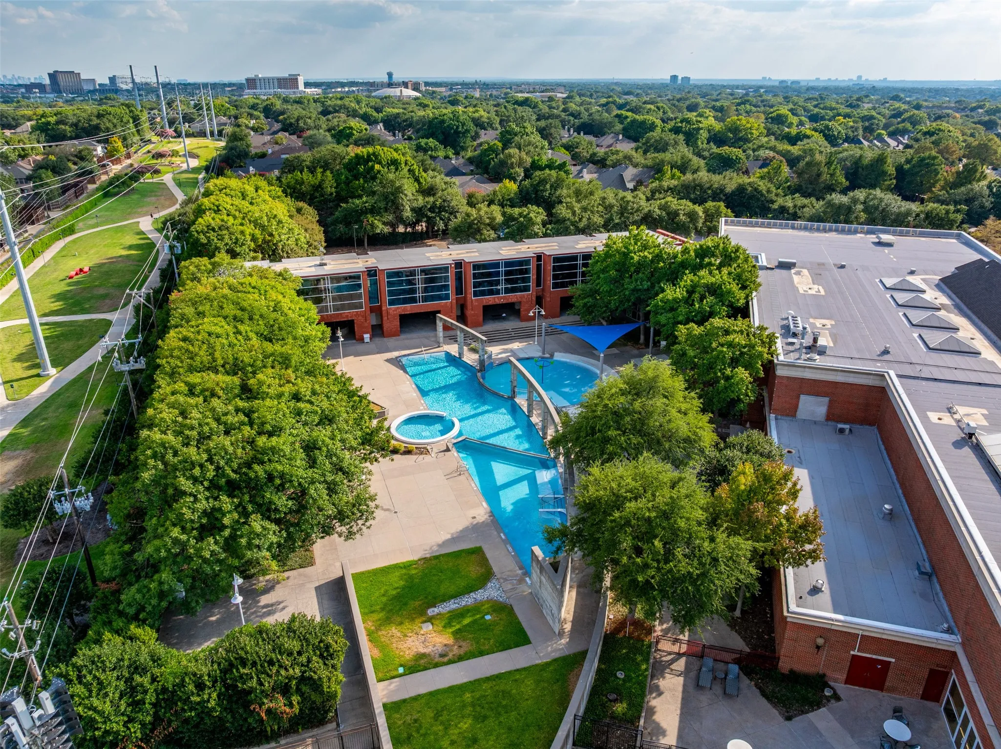 Resort-style pool with integrated spa and decorative bridge