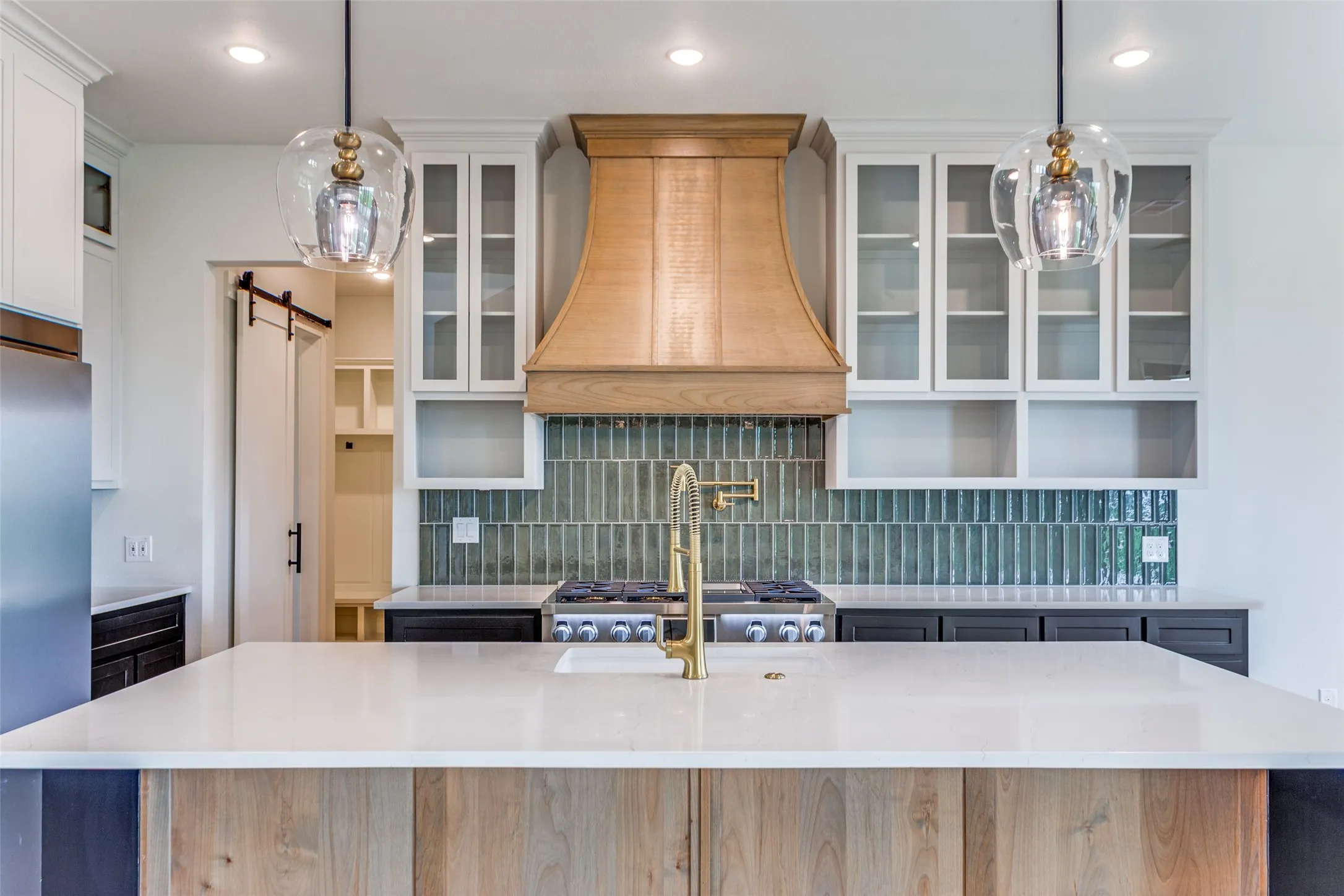 Kitchen island with a white countertop and wood-finish paneling