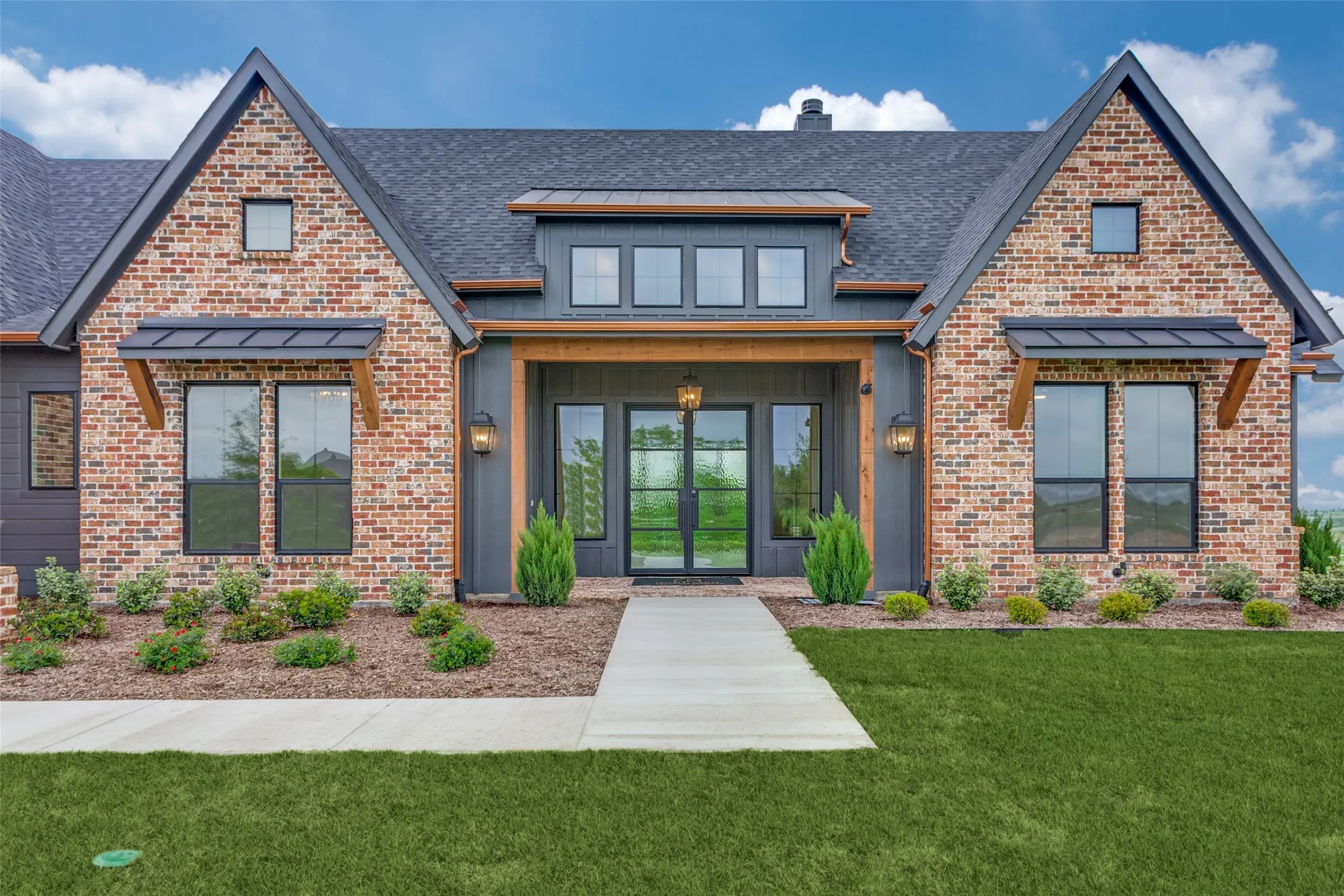 Brick and board-and-batten exterior with a gabled roofline