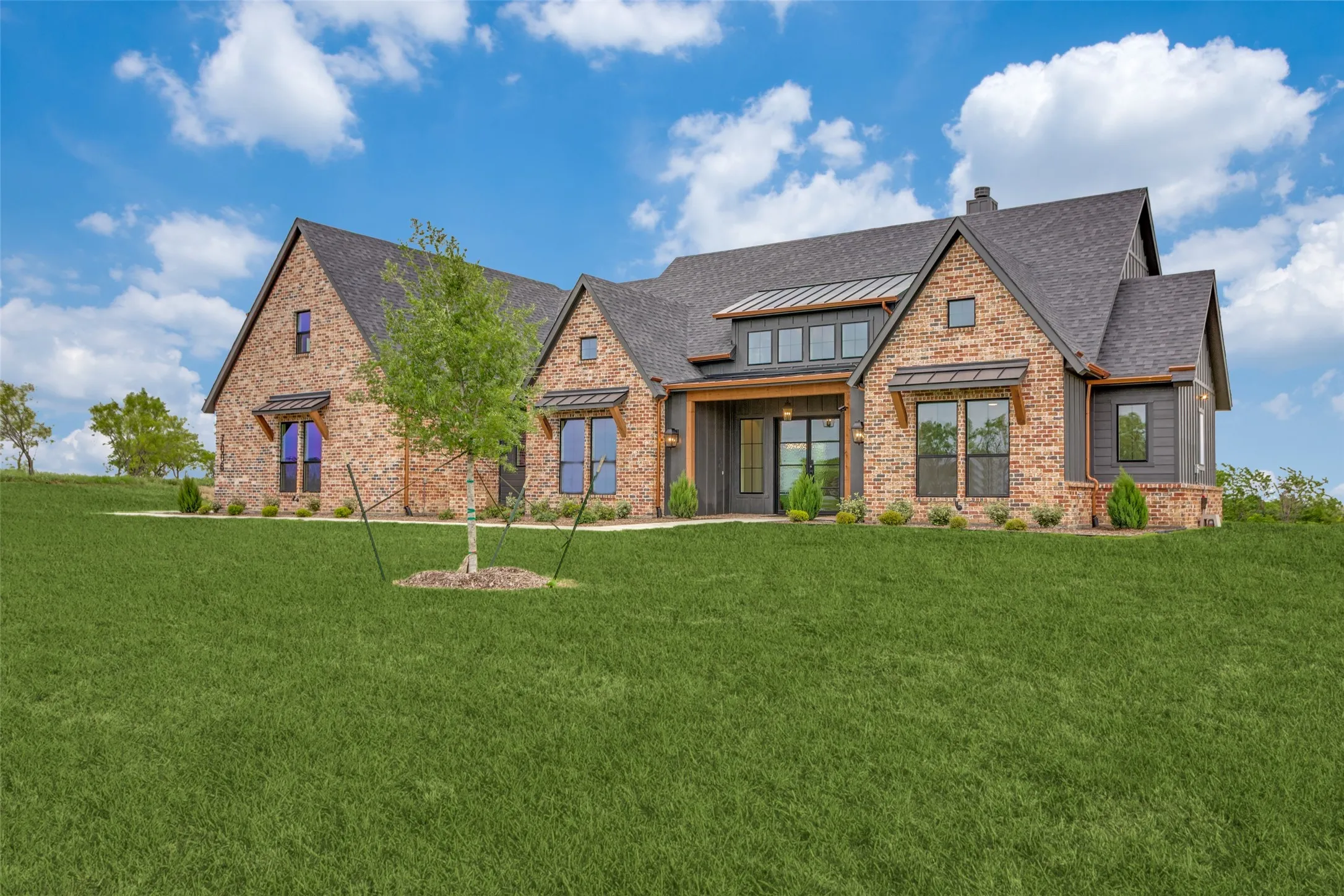 Brick and siding exterior with dark-toned roofing