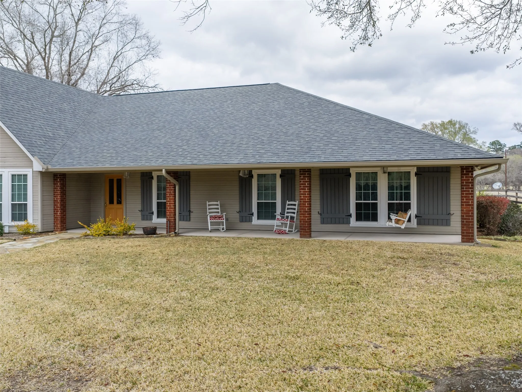 Light gray siding with a contrasting deep gray shingle roof