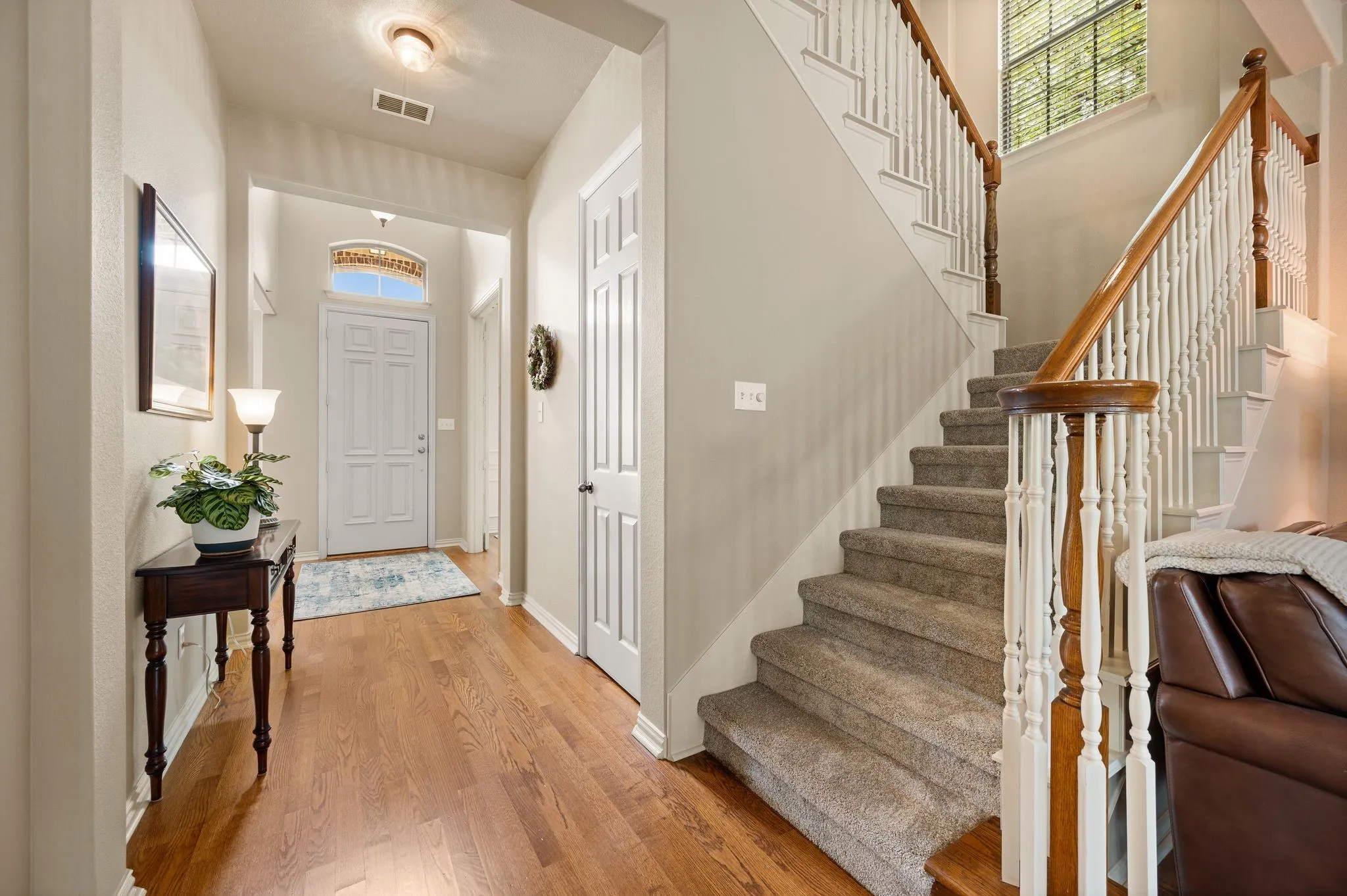 Wood-finish flooring throughout the entryway