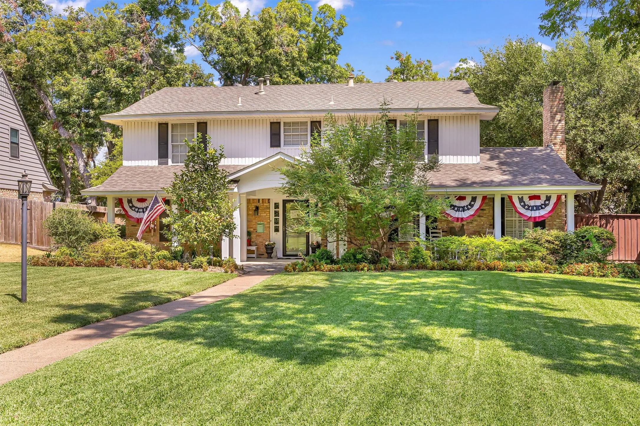 Traditional home on a large manicured .300 acre lot.