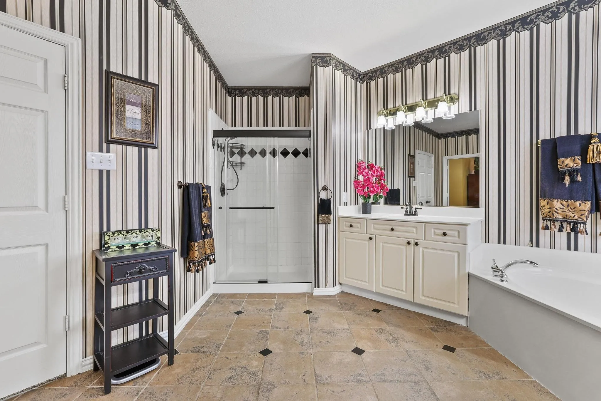 Dual vanities, garden tub and separate shower are great features in the spacious primary bathroom