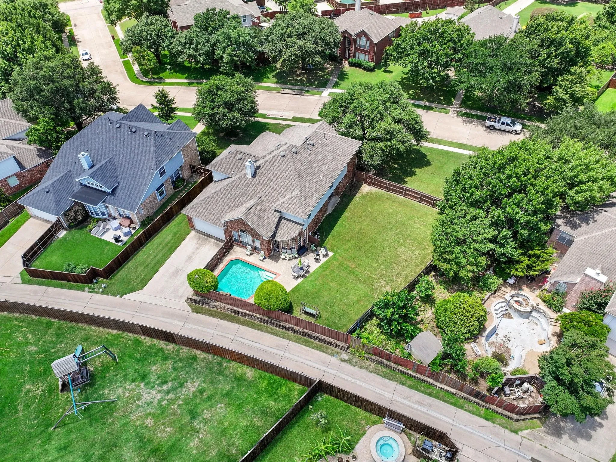 Aerial view showing the pool and backyard