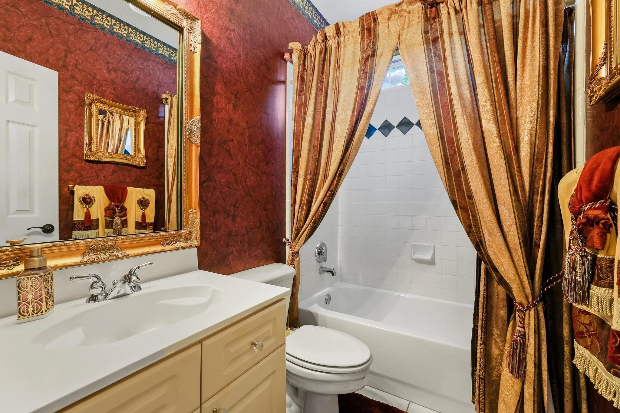 Full bath sits adjacent to the office, 5th bedroom