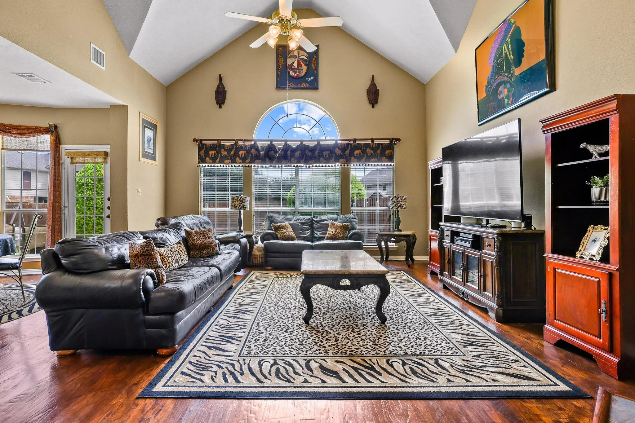 Cathedral ceilings define the spacious family room