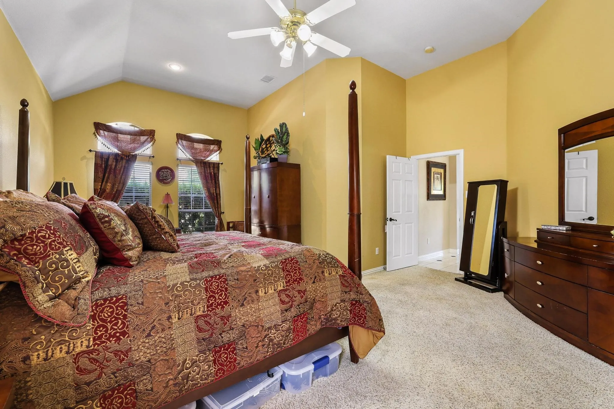 Vaulted ceiling in the primary suite makes it feel extra spacious