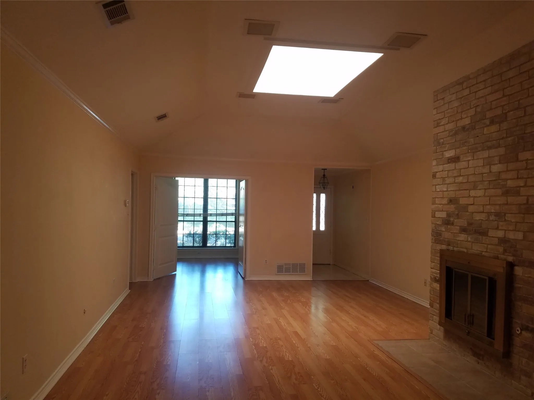 Living room with skylight and fireplace