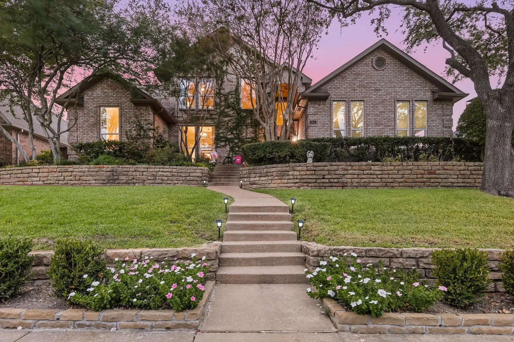 Beautiful drive up appeal with towering oak trees, lush landscaping and stone retaining​​‌​​​​‌​​‌‌​‌‌​​​‌‌​‌​‌​‌​​​‌​​ wall.