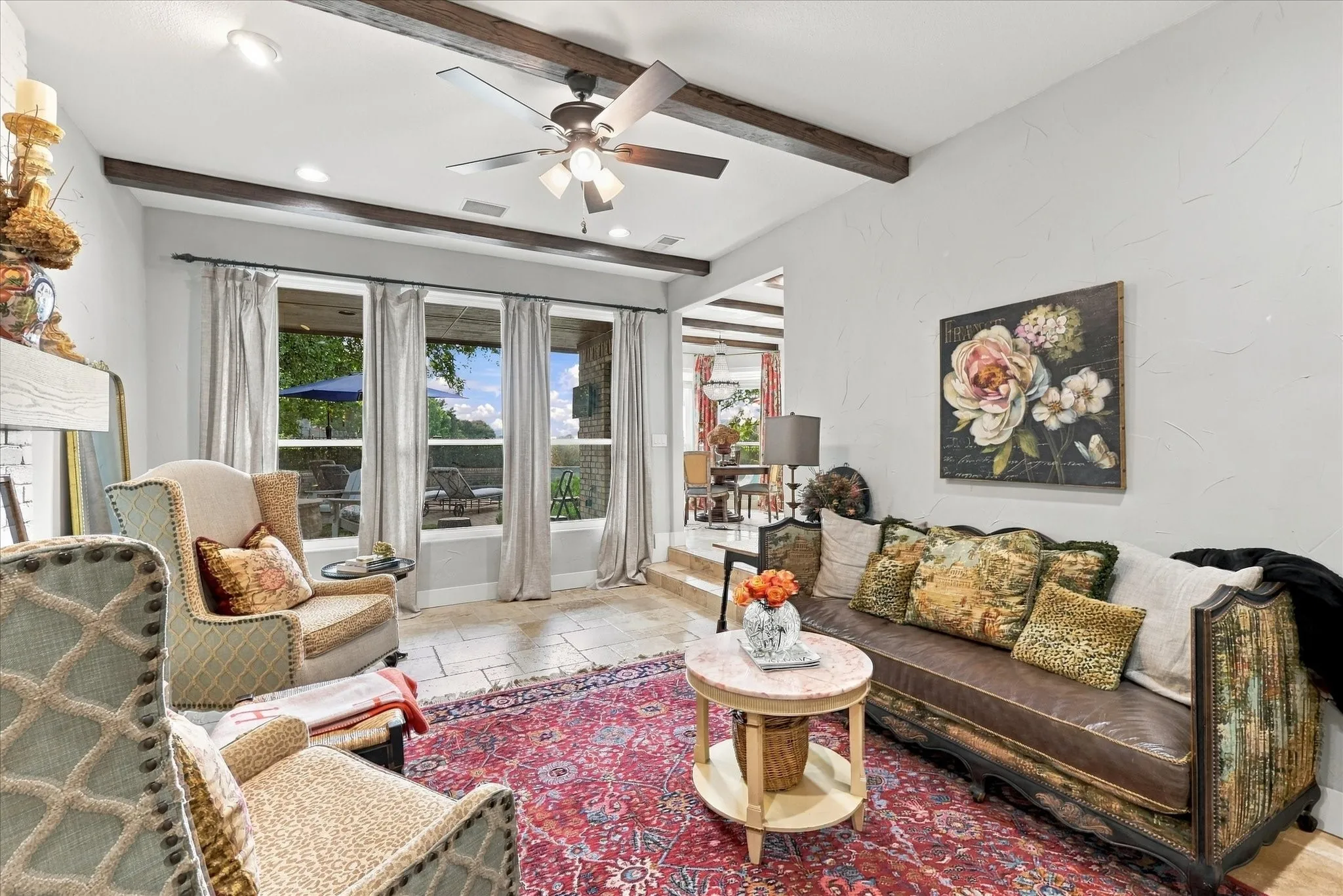 Additional view of secondary living area overlooking backyard with specatular views of pool and fire pit.