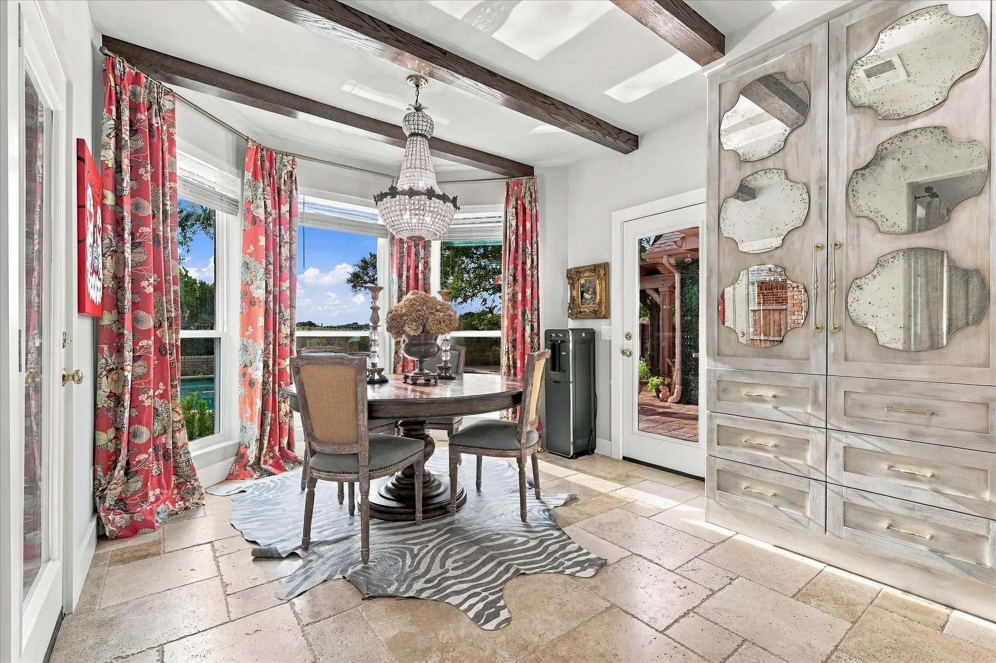 Breakfast area with beautiful views of pool area and golf course & additional cabinets for storage.