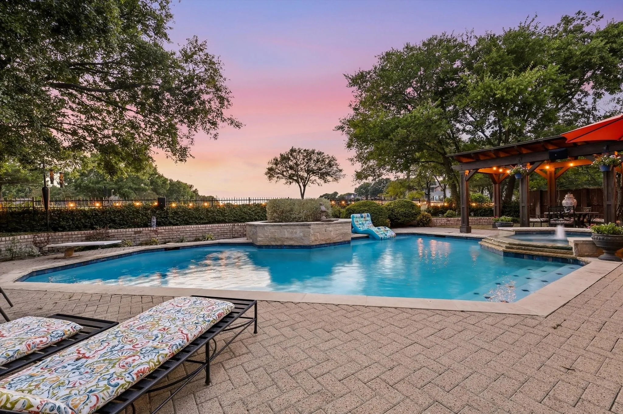 Additional view of pool that features covered pergola and huge decked area for those large gatherings.