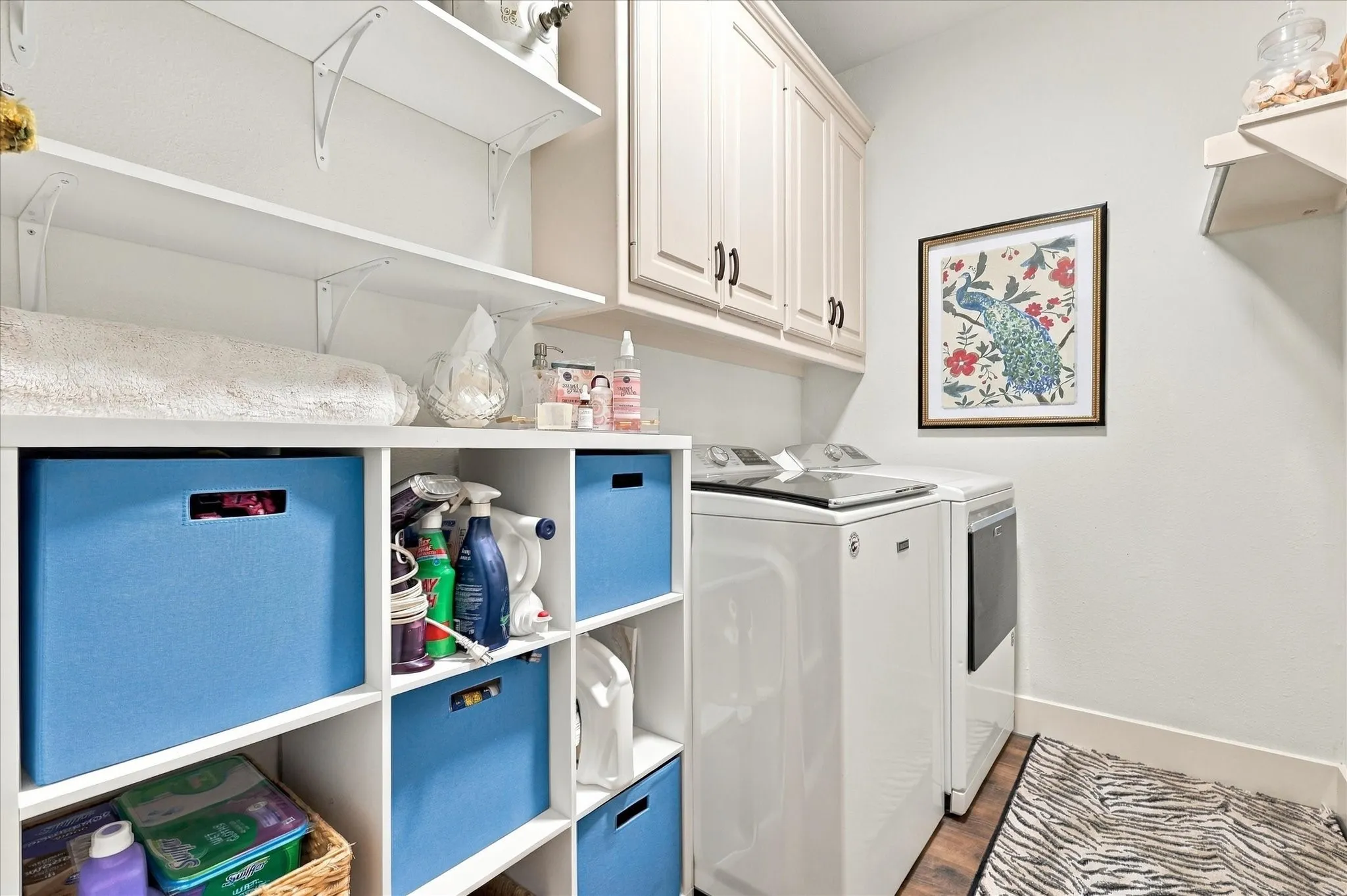 Downstairs utility room with cabinets and shelving