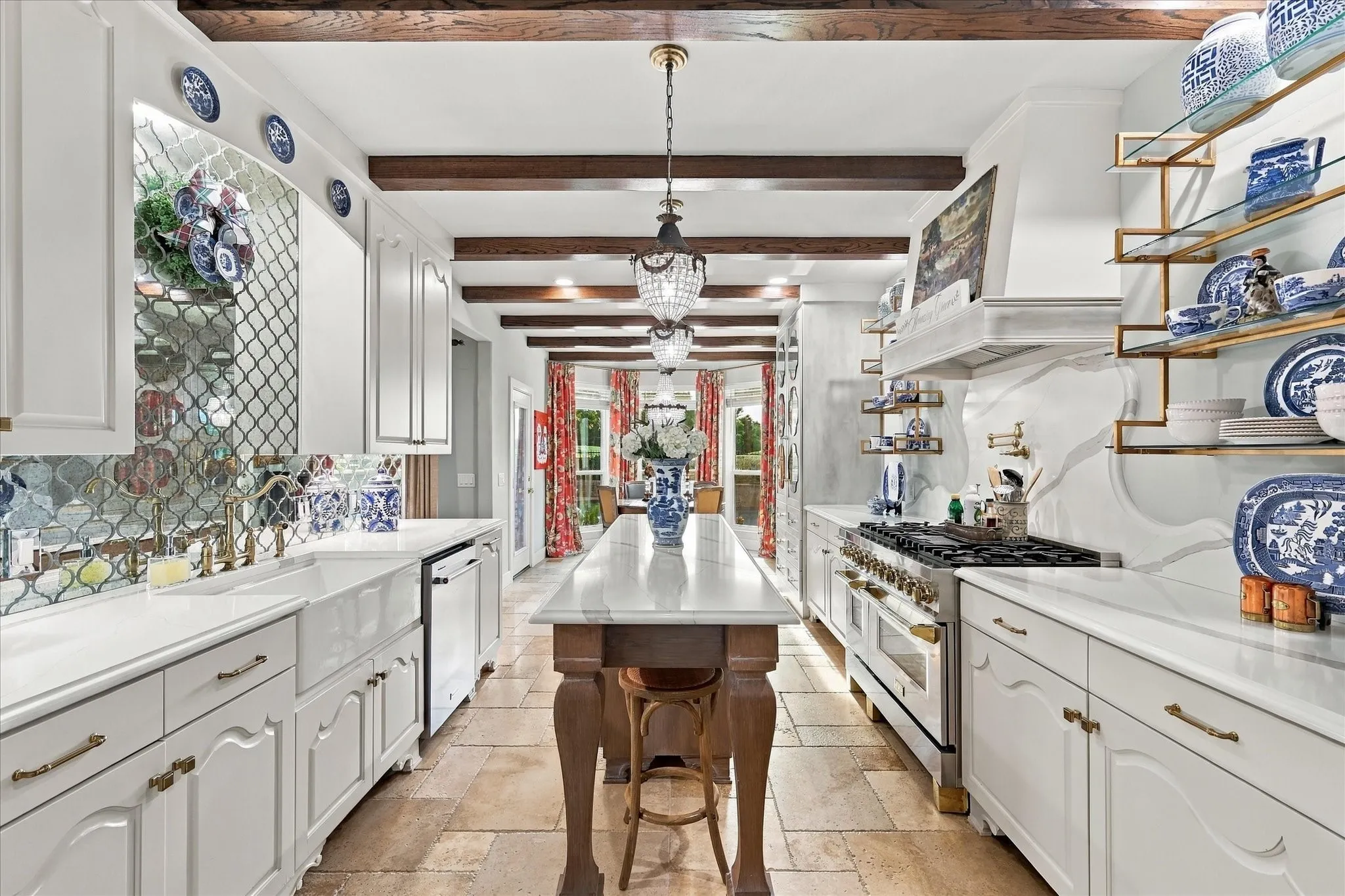 Extraordinary kitchen with quartz counter tops, new custom cabinets throughout with soft pull handles and Z-Line 8 burner gas range with double oven & pot filler