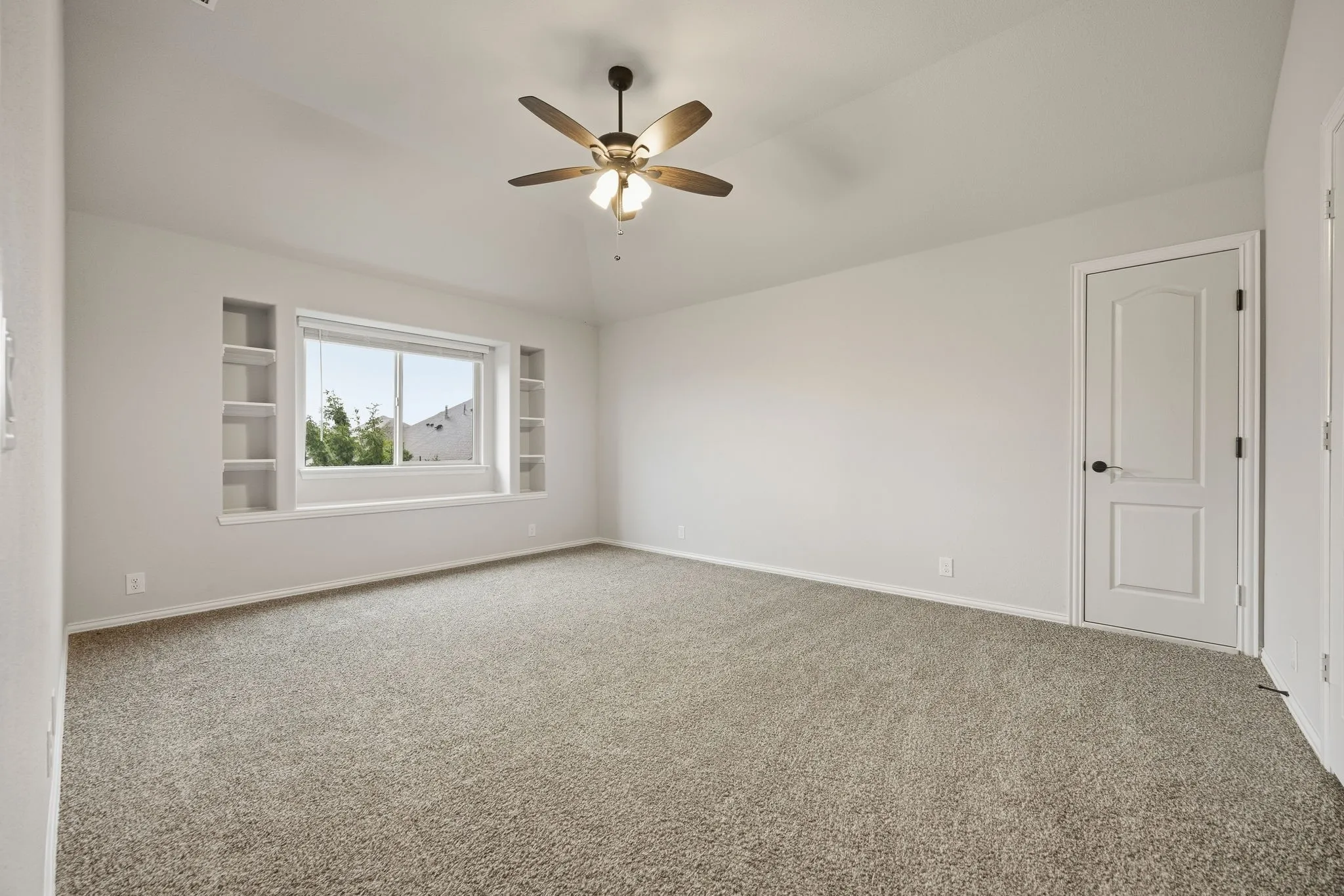Upstairs bedroom with built in shelving