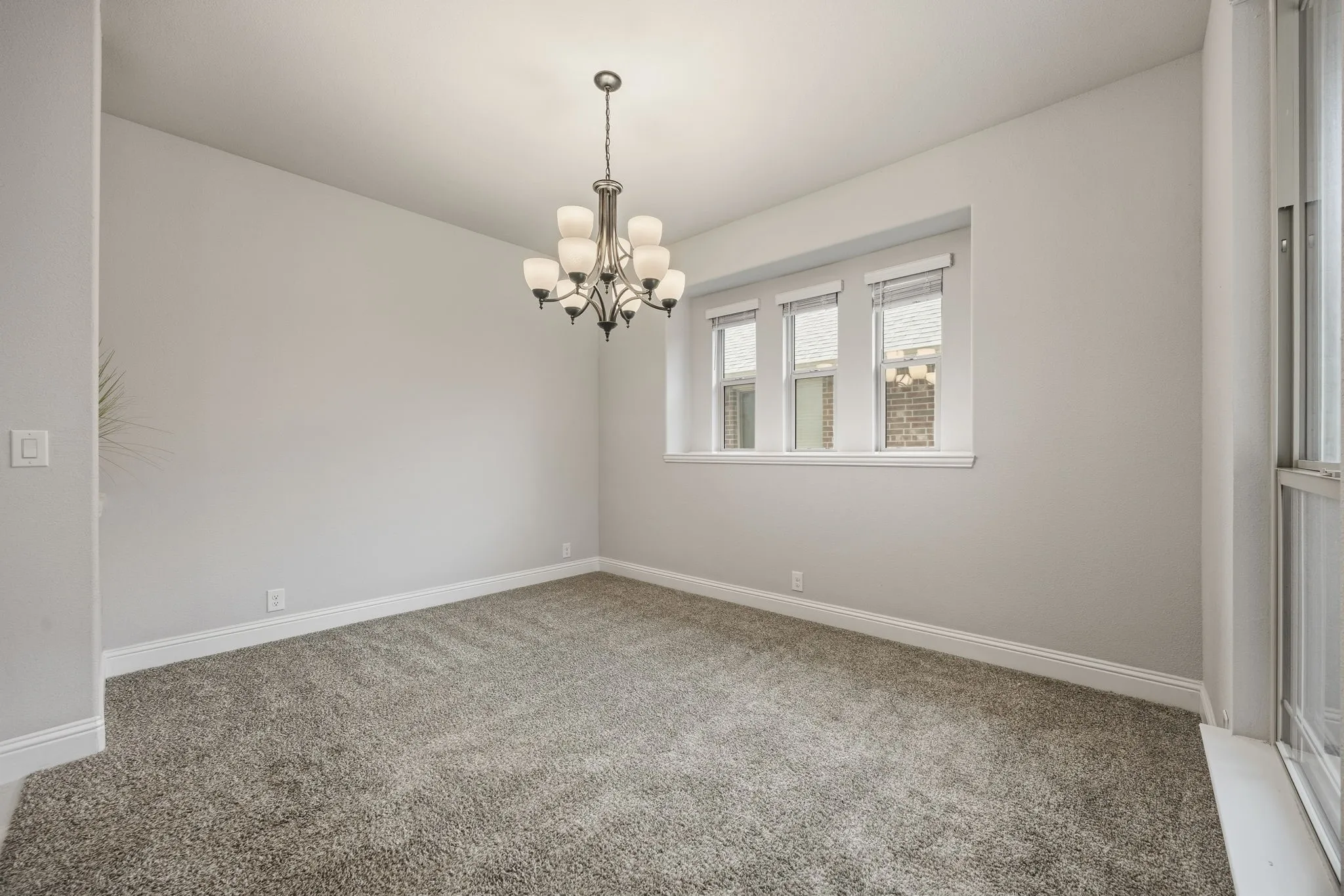 Triple windows give light to this front room