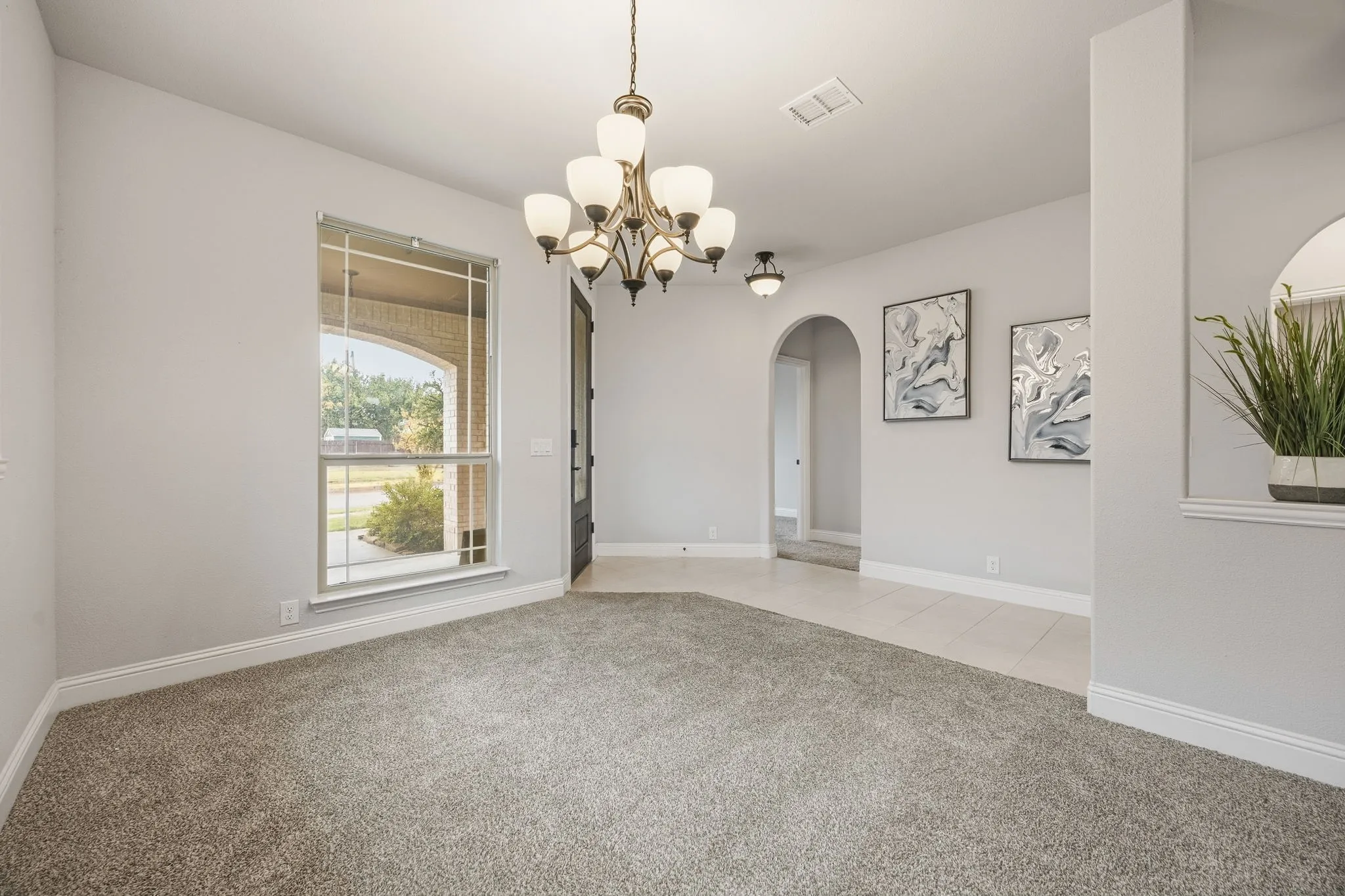 Formal dining or flex space at the front of the home