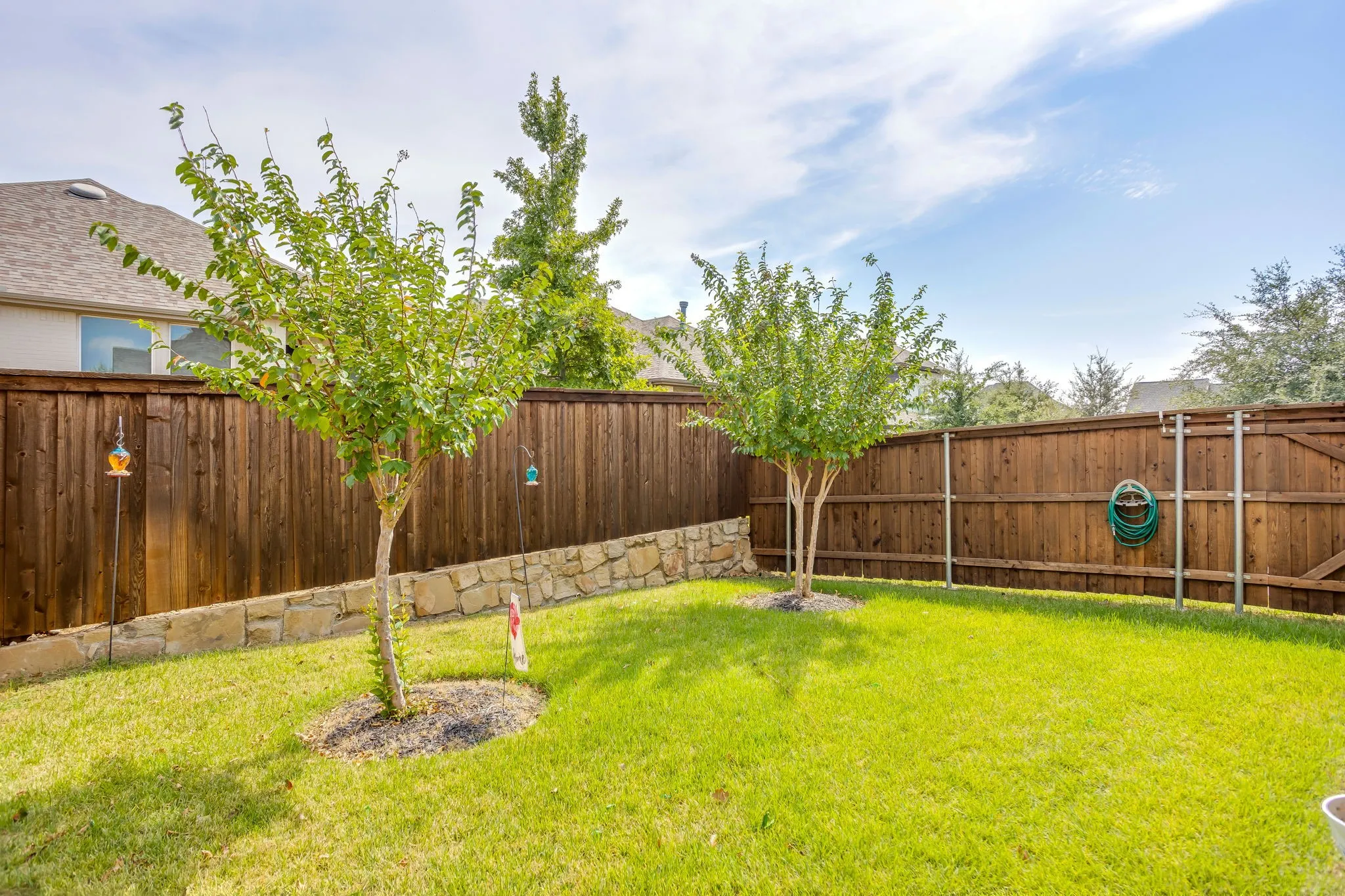 Natural grass backyard ... perfect for pets and play.