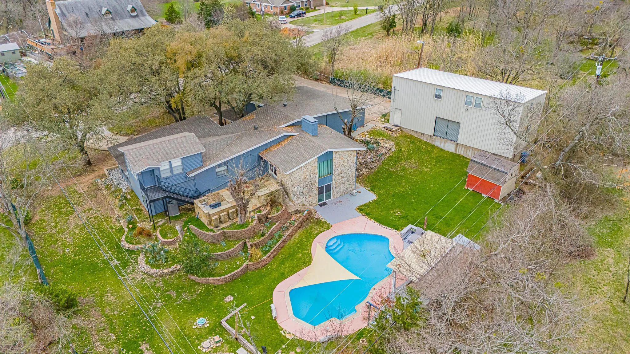 Aerial View of House, Outer buildings and back yard
