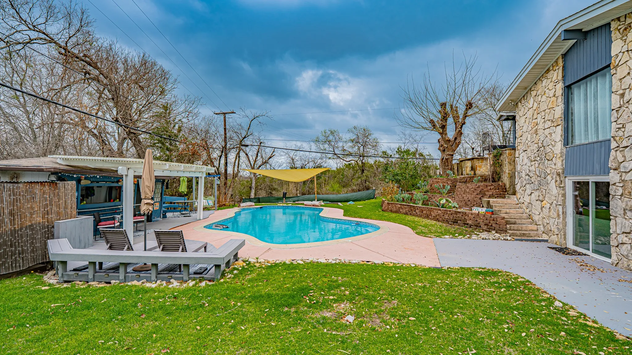 Back yard with entertaining area and pool