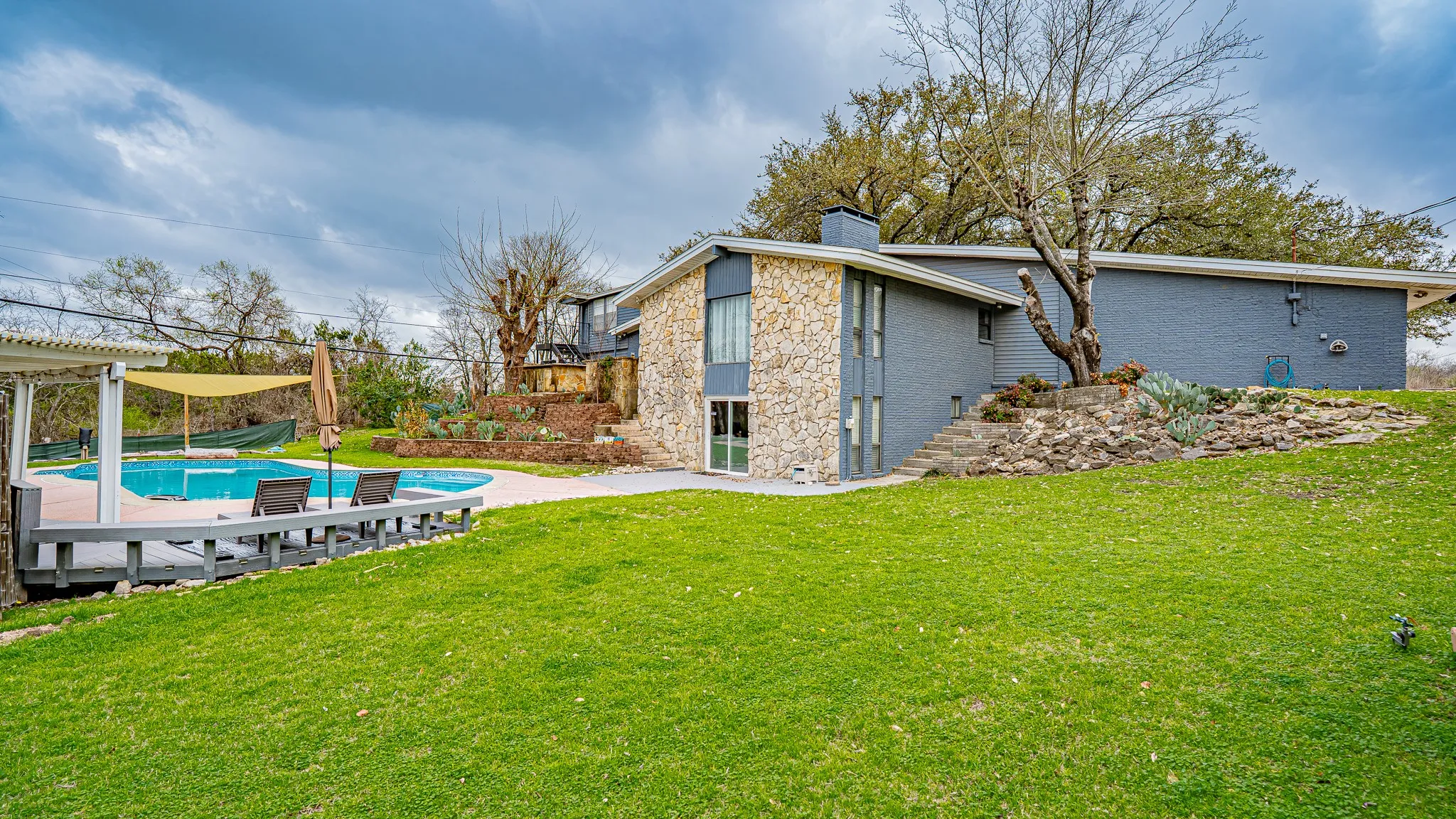 Back and side of house with pool area