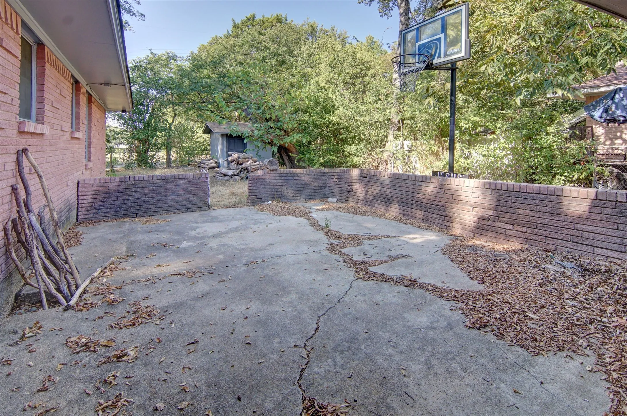 Brick exterior with an extended concrete pad