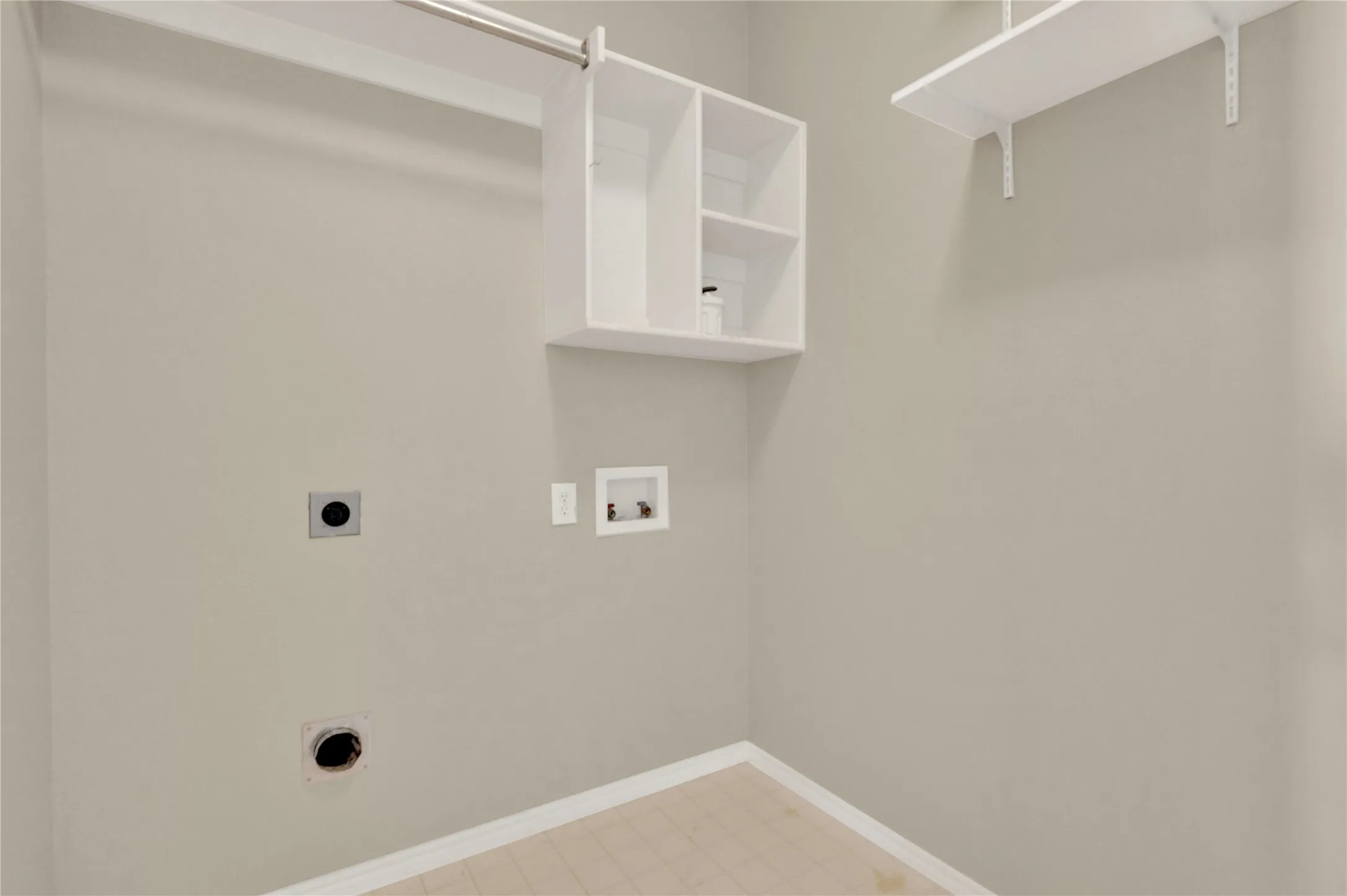 Built-in shelving, mounted clothes hanging rod, and wall-mounted shelving for organized storage