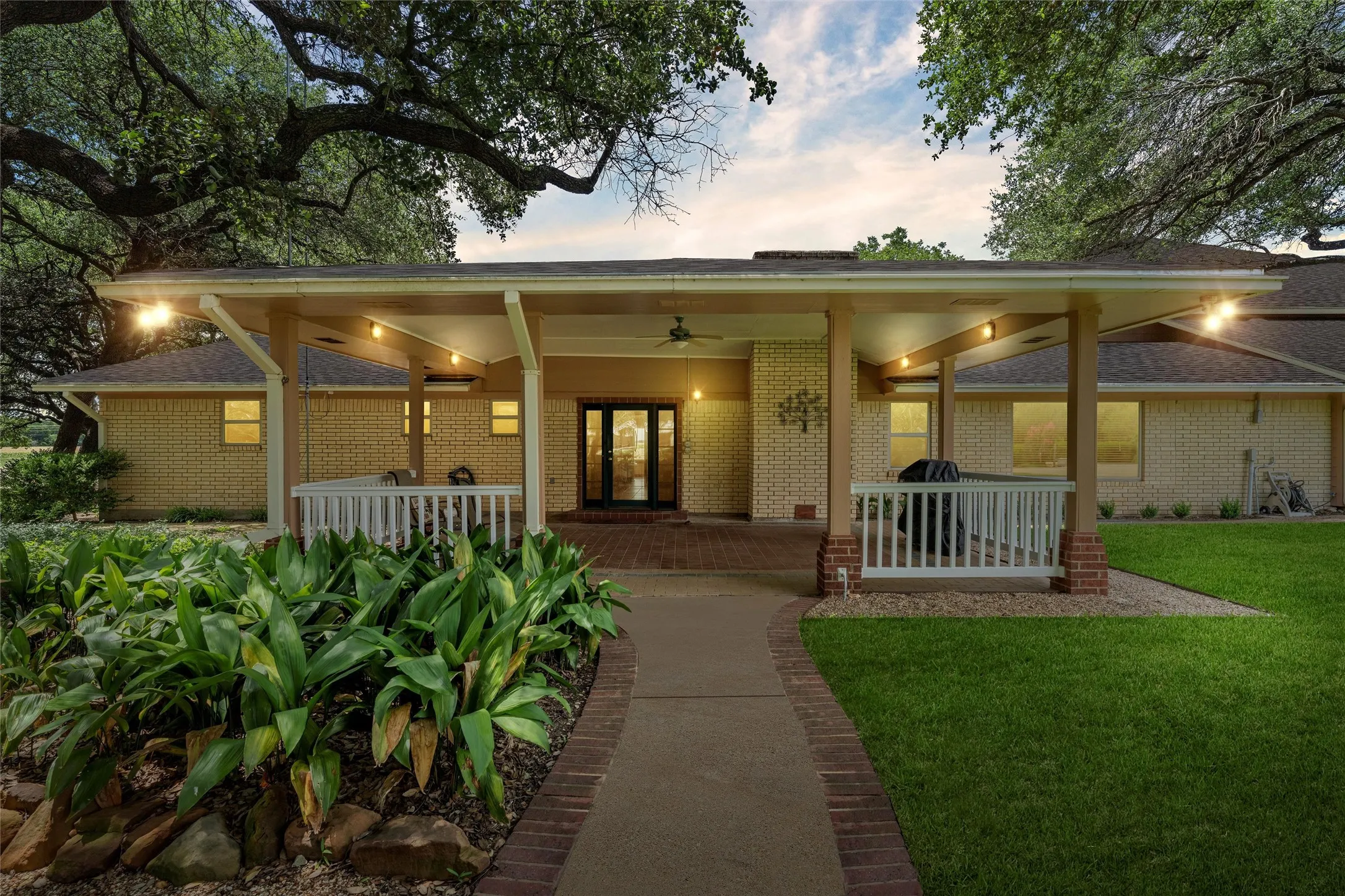 Expansive covered front porch with recessed lighting