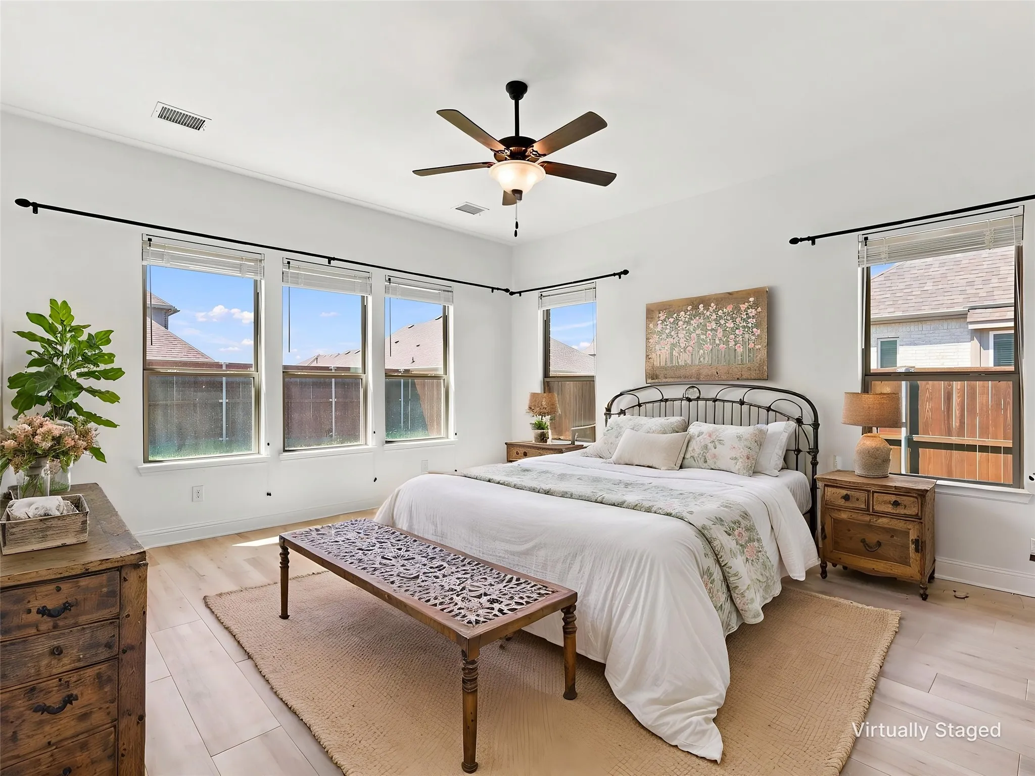 Private first floor primary bedroom is tucked away for total privacy!
