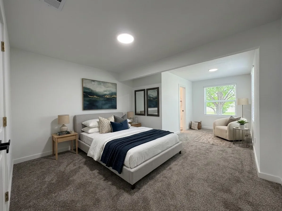 Wall-to-wall carpeting throughout, with a recessed window and white blinds