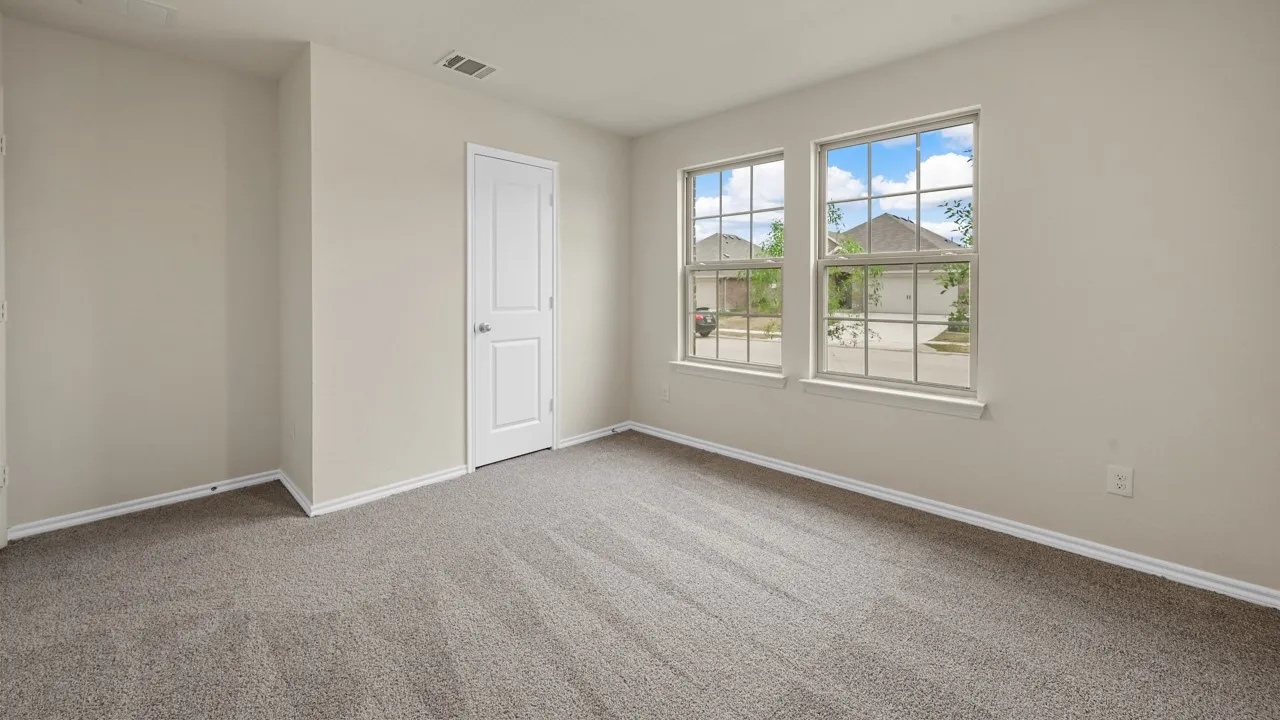 Wall-to-wall carpeting and white trim throughout