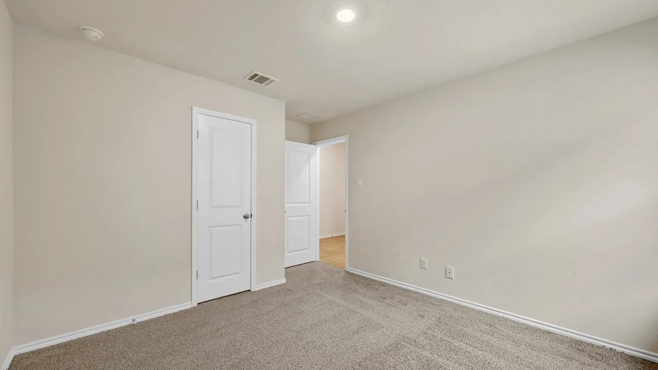 Carpet flooring, recessed lighting, and white paneled doors