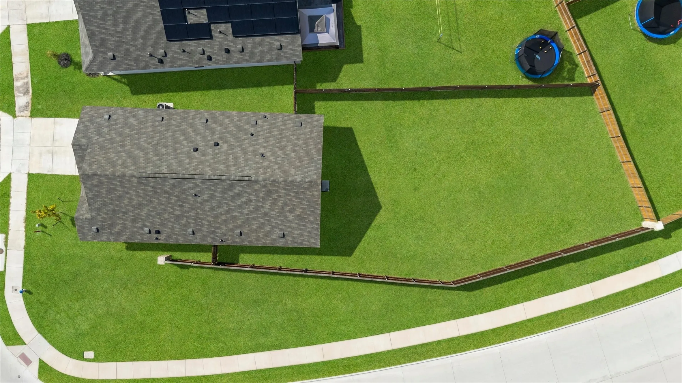 View of home and lot. HOA takes care of the side fence.