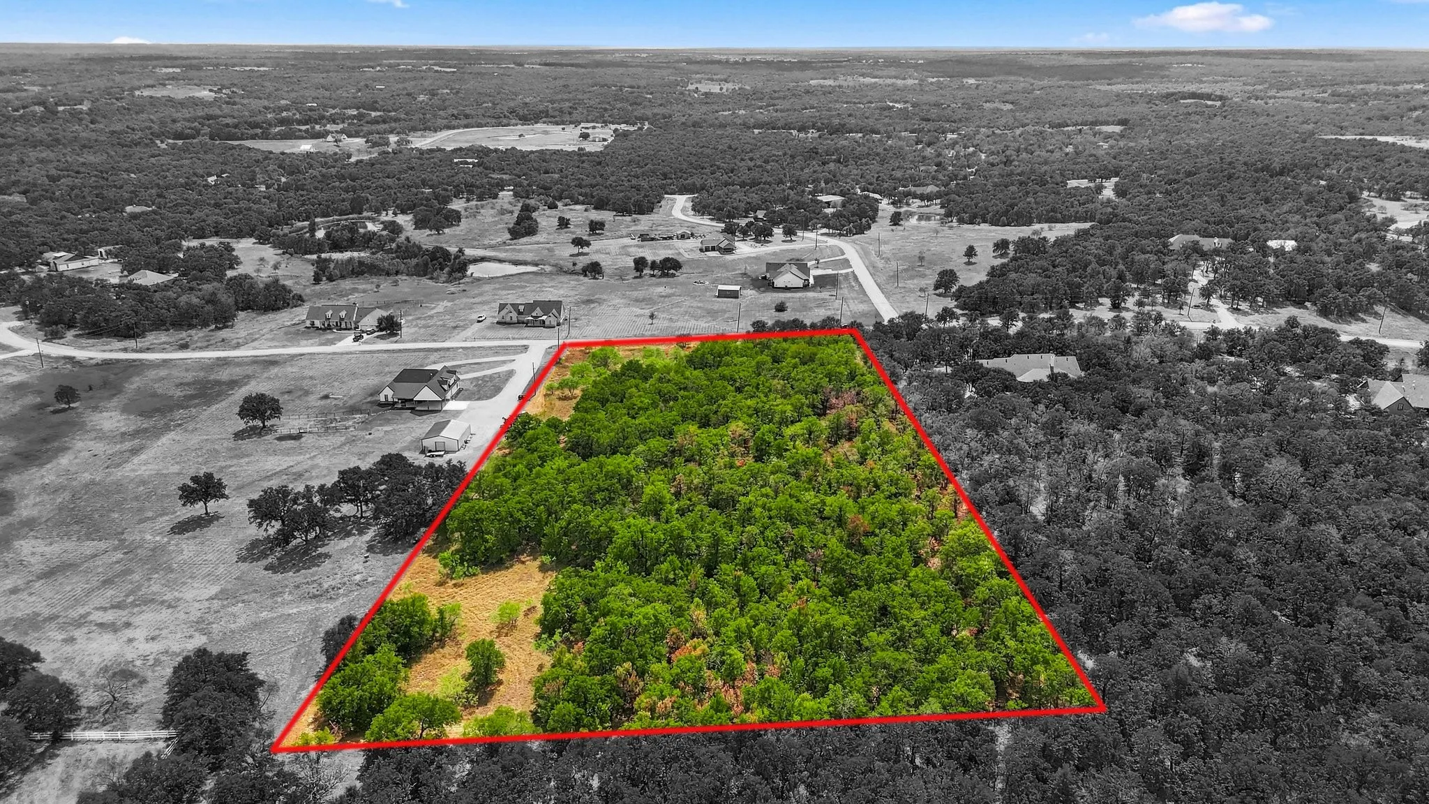 5 Acres! Expansive undeveloped lot featuring dense tree coverage. 310' W X 702' D