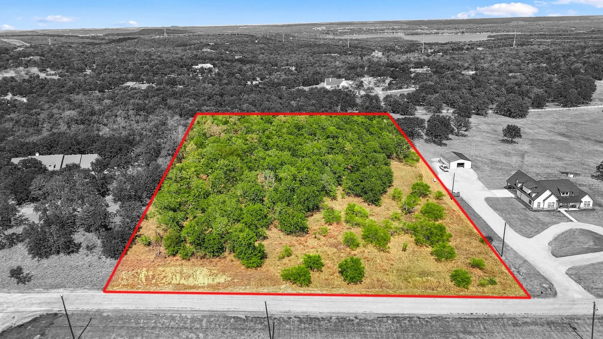 Expansive lot featuring mature trees and open clearings