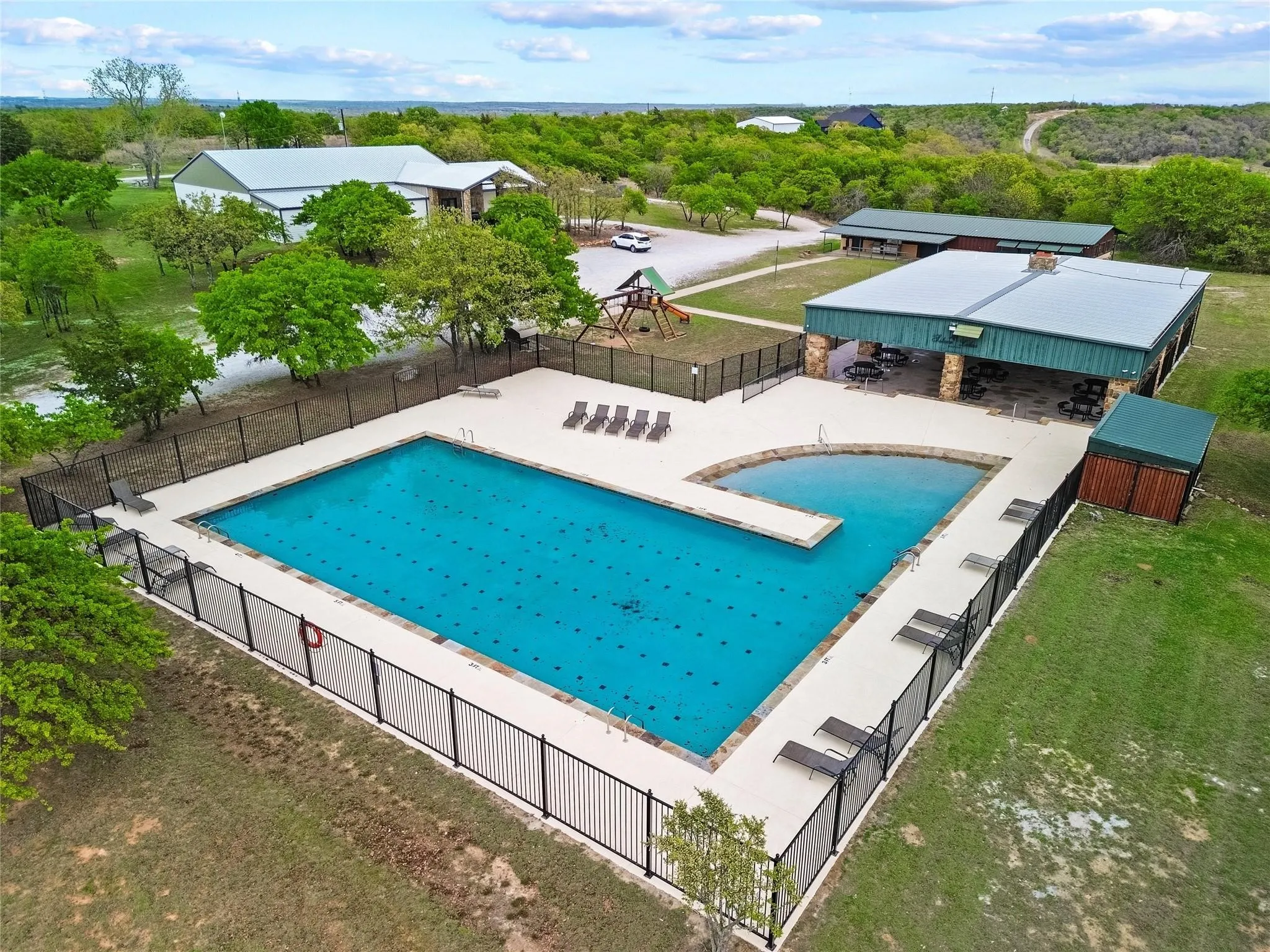 Expansive outdoor community Swimming Pool, Pavilion, Playground & Fitness Center.
