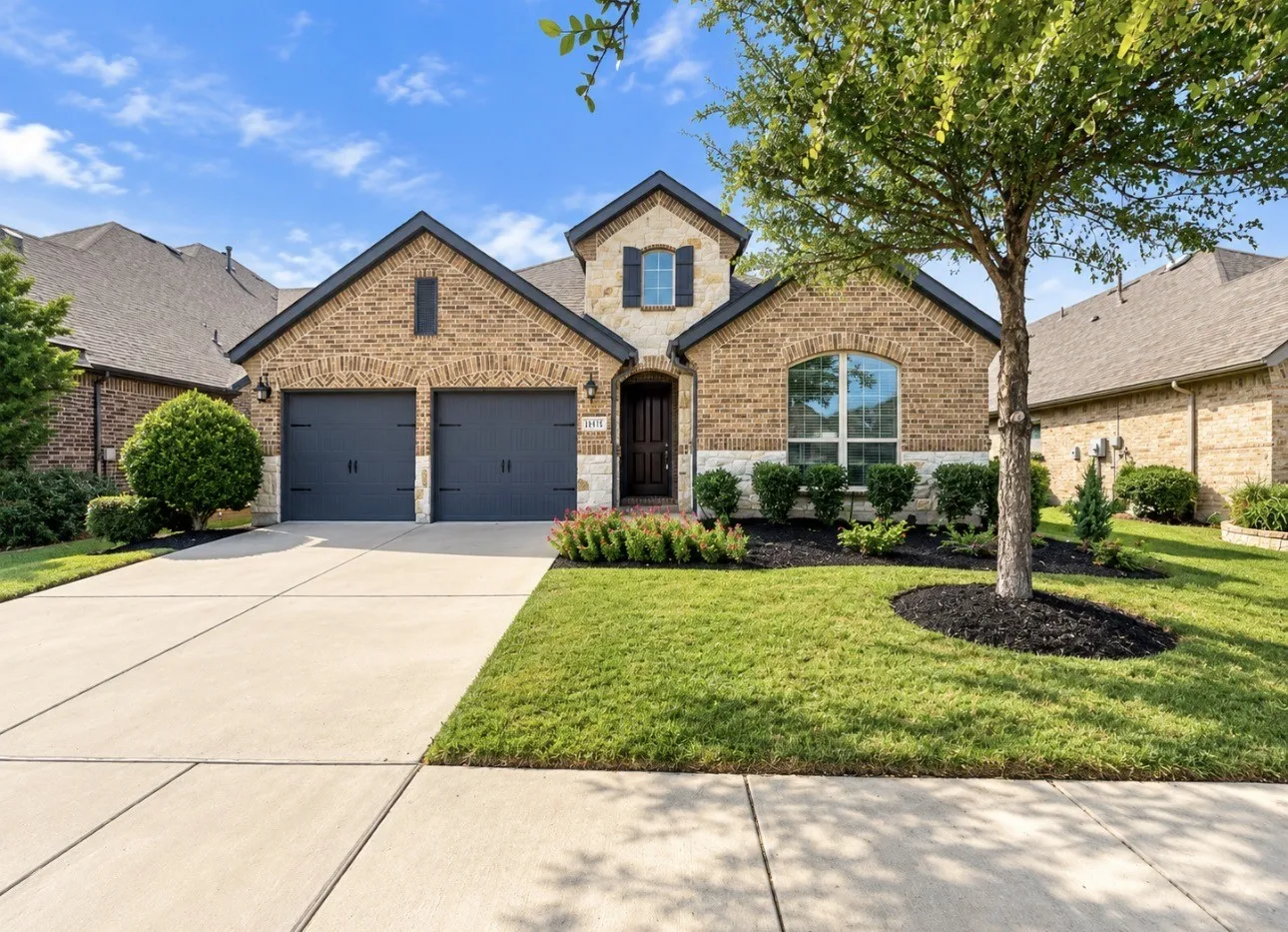 Brick and stone exterior with dark trim