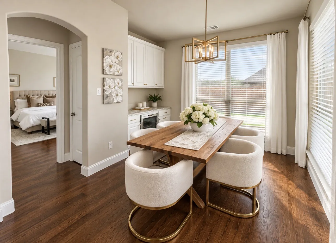 Wood-finish flooring, built-in cabinetry, recessed lighting, and a geometric chandelier