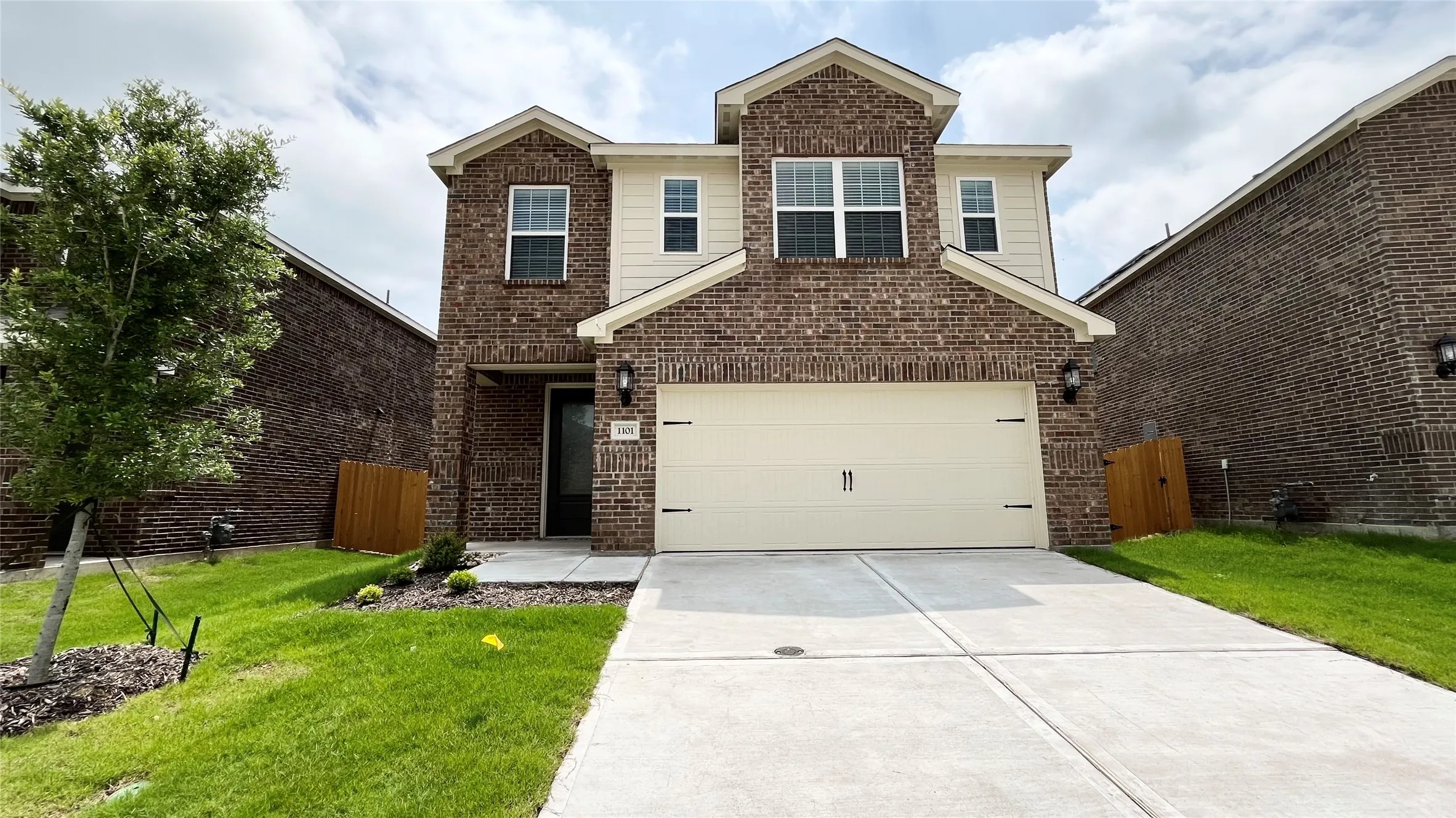Brick and siding facade with gabled roof lines