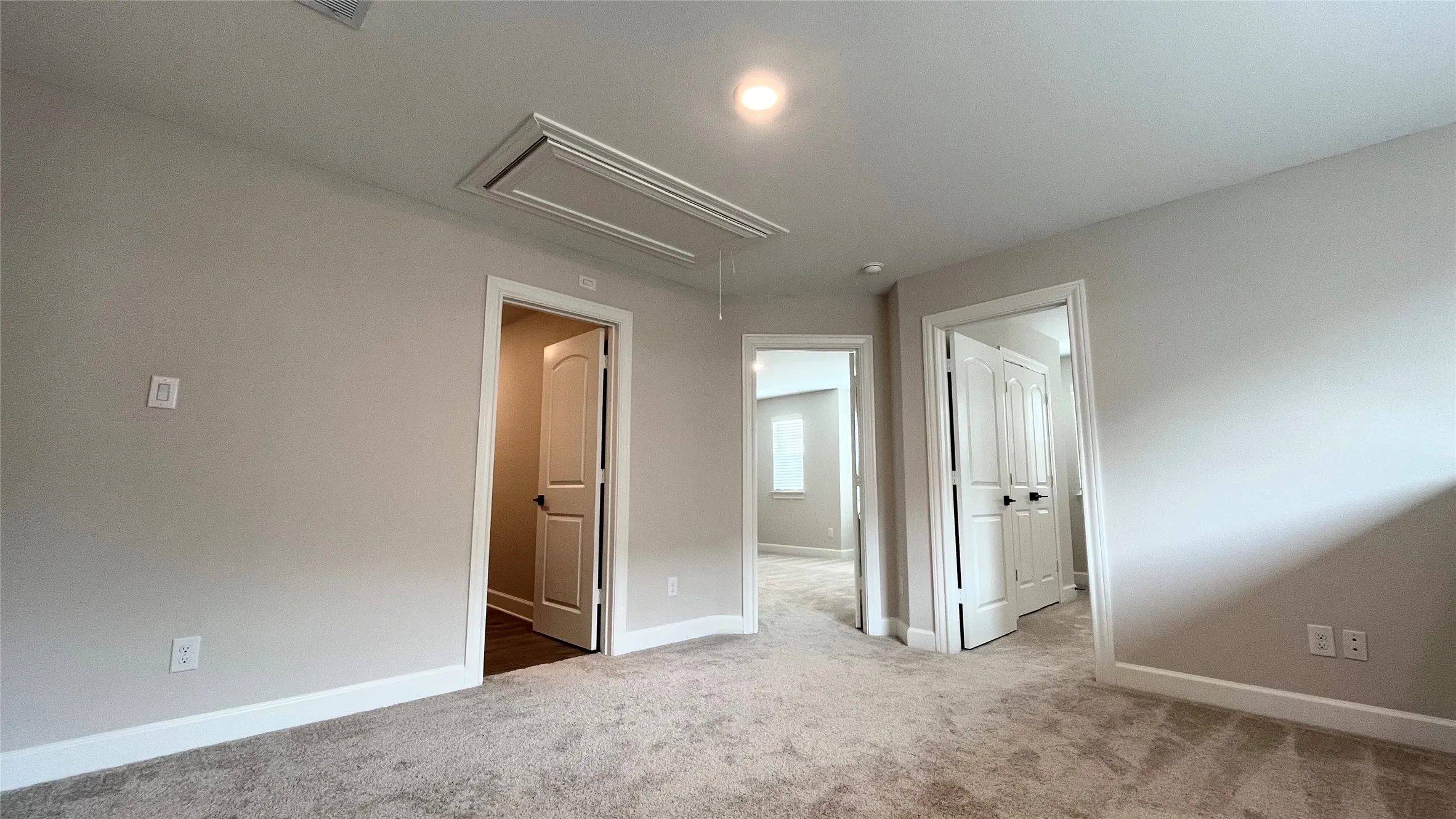 Carpeted flooring throughout, neutral wall paint, white trim, and recessed lighting