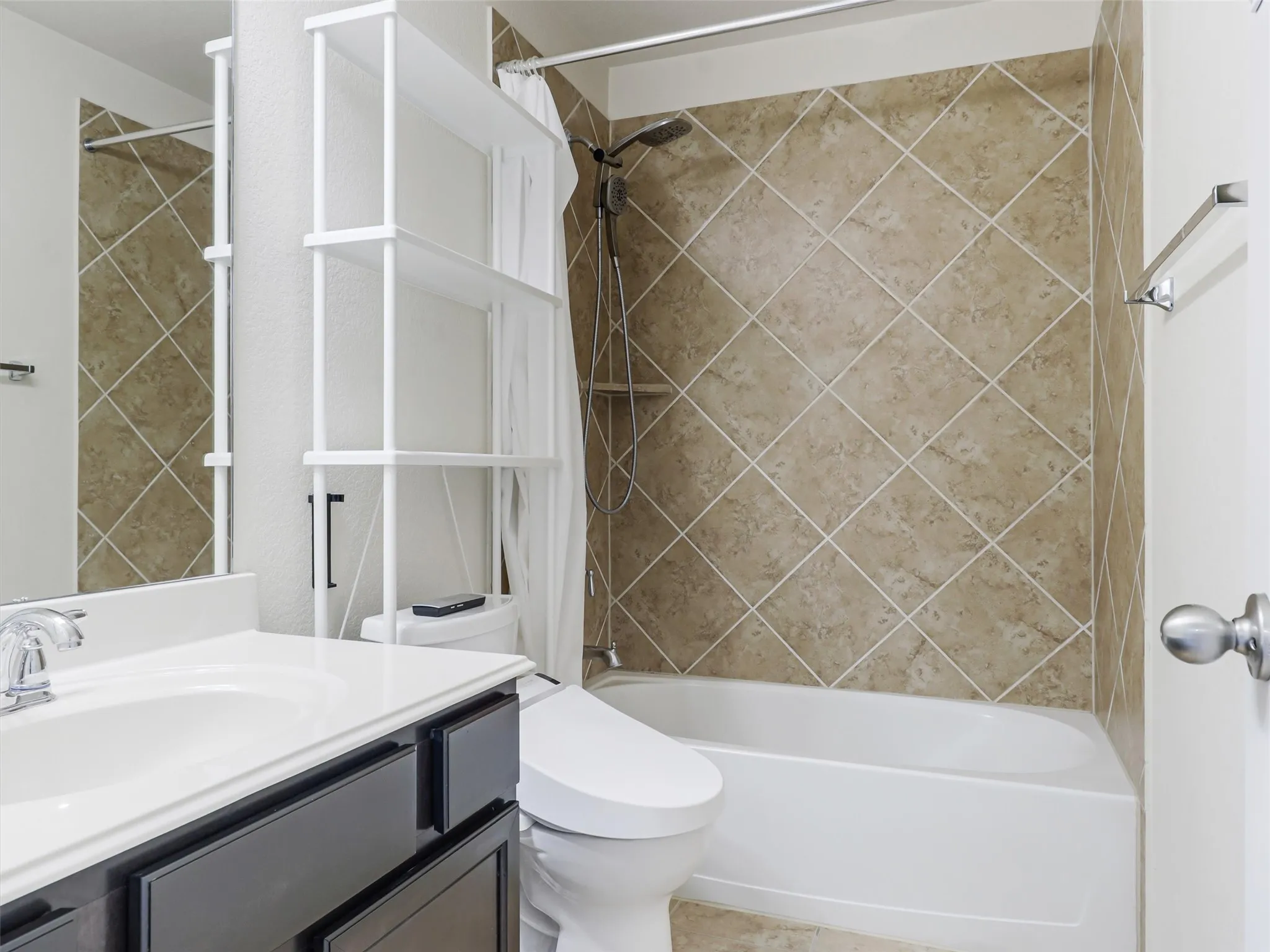 Full bathtub with a tiled shower surround