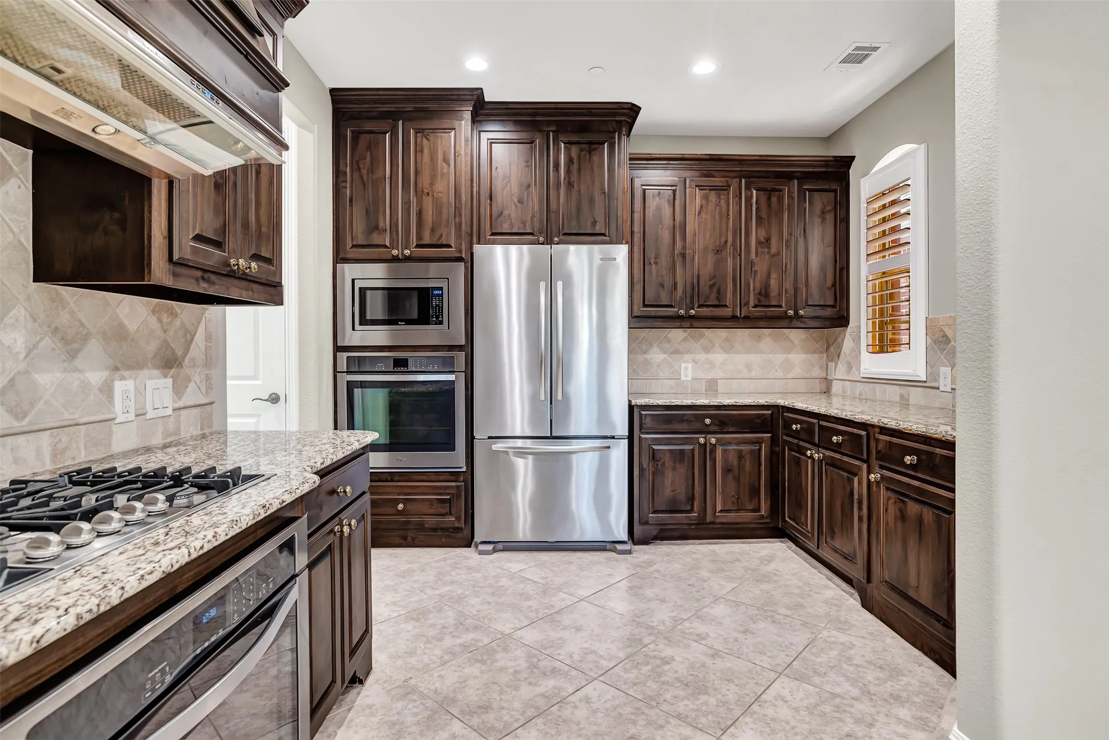Just look at all this counter and cabinet space, it goes on for miles! Food prep and cooking will be a breeze.